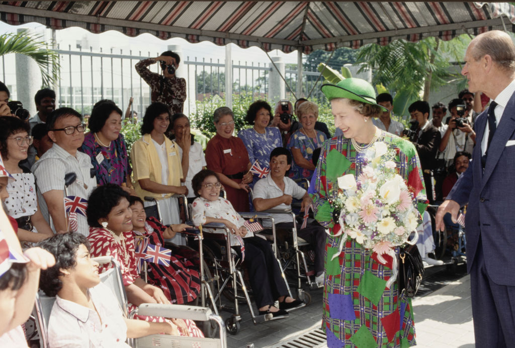 Queen Elizabeth II and Prince Philip greet well-wishers during a walkabout in Kuala Lumpur, Malaysia, Oct. 17, 1989. (Tim Graham Photo Library via Getty Images)
