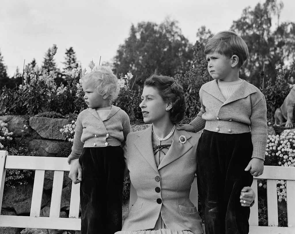 14th November 1952:  Queen Elizabeth II with Prince Charles and Princess Anne in the grounds of Balmoral Castle, Scotland. Charles is celebrating his 4th birthday. (Lisa Sheridan-Studio Lisa/Hulton Archive/Getty Images)