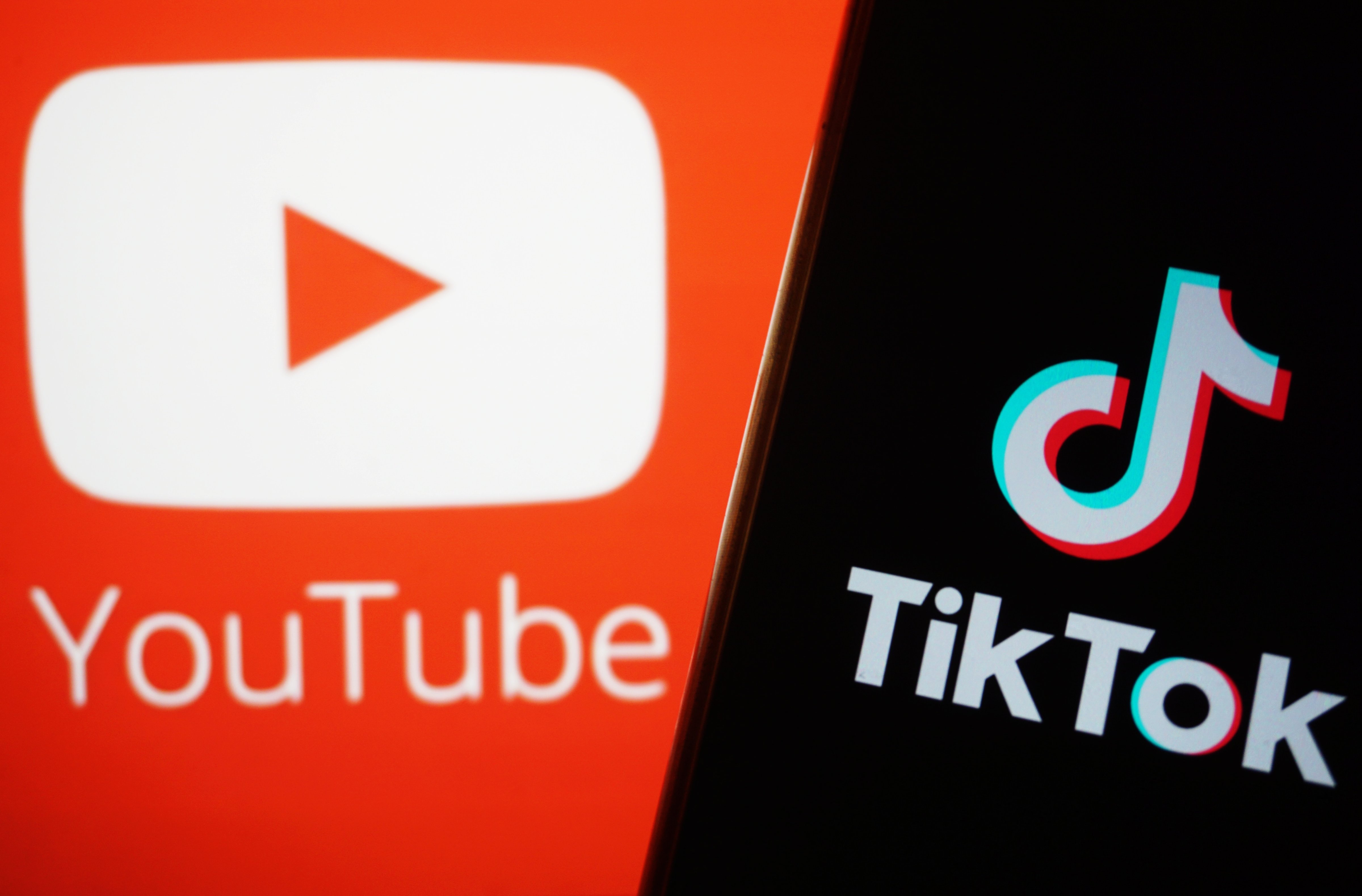 The YouTube and TikTok logos (CFOTO/Future Publishing—Getty Images)