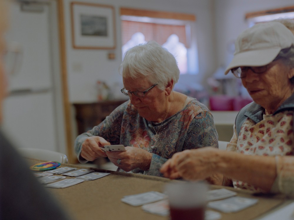 Kathleen, 84, left, and Rose, 79, play cards at the Glenwood Senior Center. 