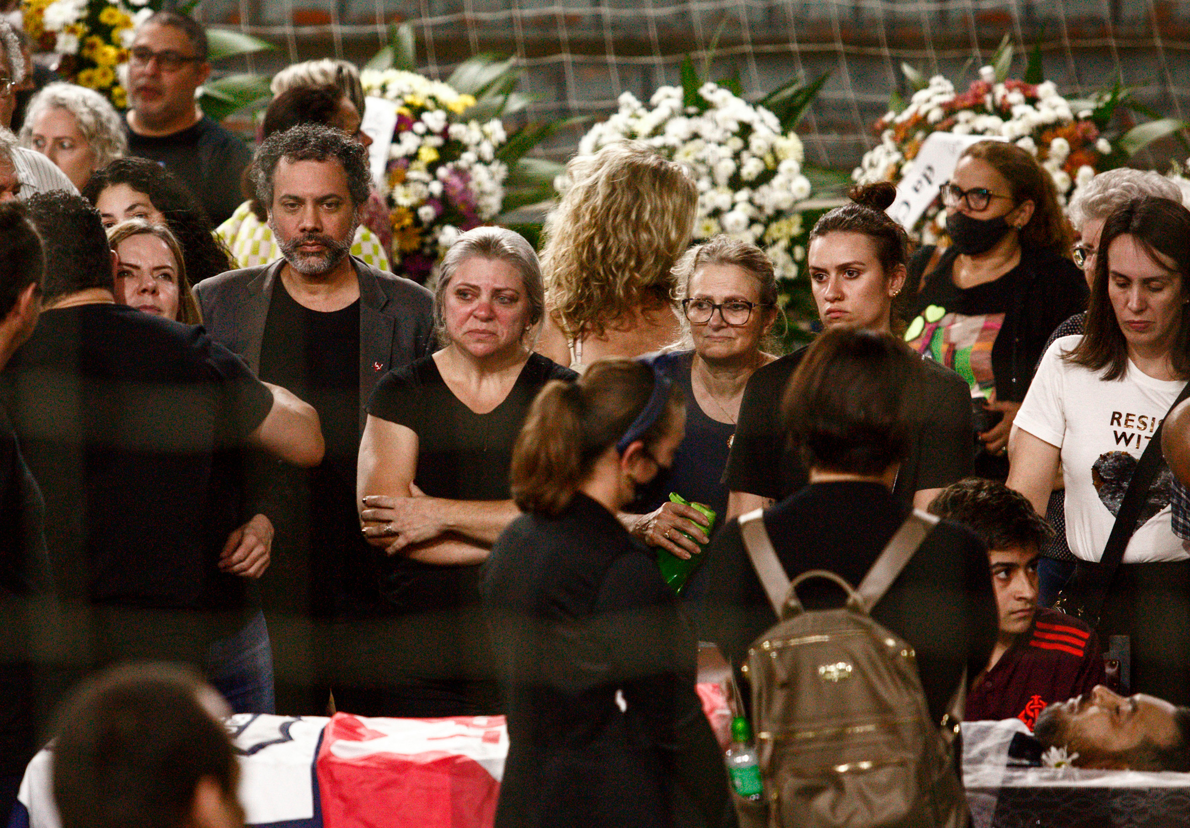 People attend the funeral of Marcelo Arruda held inside the Sebastiao Flores gymnasium in Foz do Iguacu, Brazil, July 10. An advocate of former Brazilian President Luiz Inacio Lula da Silva who is running for election, Arruda was shot dead at his birthday party. (Alexander Moschkowich—AP)