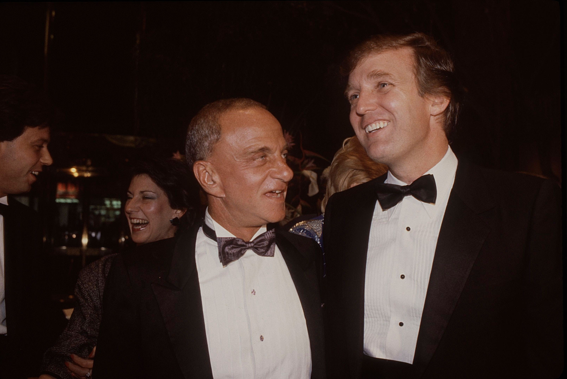 Roy Cohn (L) and Donald Trump attend the Trump Tower opening in October 1983 at The Trump Tower in New York City. (Sonia Moskowitz—Getty Images)