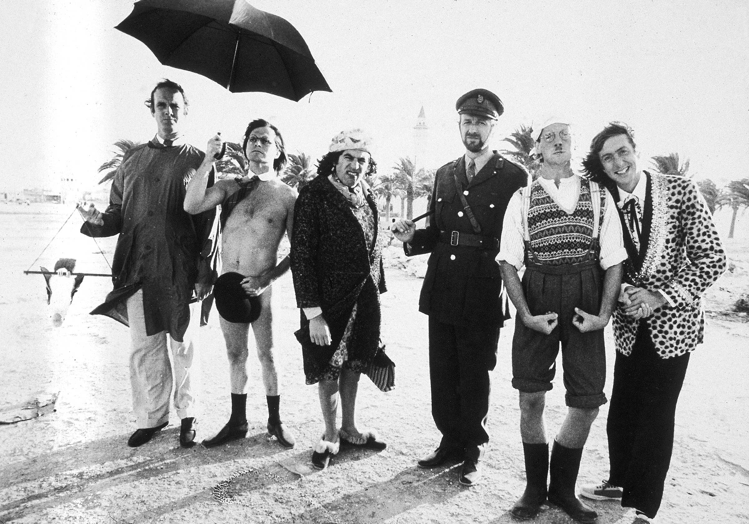 Idle (far right) with members of the Monty Python team on location in Tunisia to film <em>Monty Python's Life of Brian</em>, which features the song 