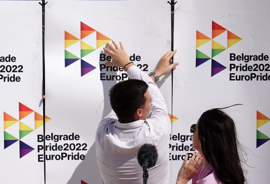 An LGBT volunteer adjusts a banner during the opening ceremony of the EuroPride 2022 in Belgrade on September 12, 2022. (Oliver Bunic—AFP/Getty)