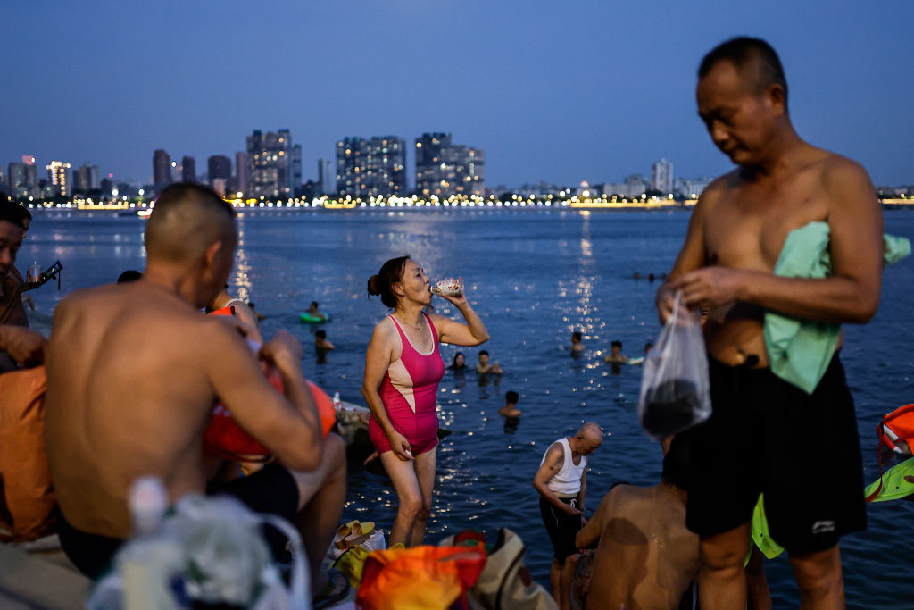 People swim in the intersection of the Han and Yangtze rivers during a heat wave on August 10, 2022 in Wuhan, Hubei Province, China. (Getty Images)