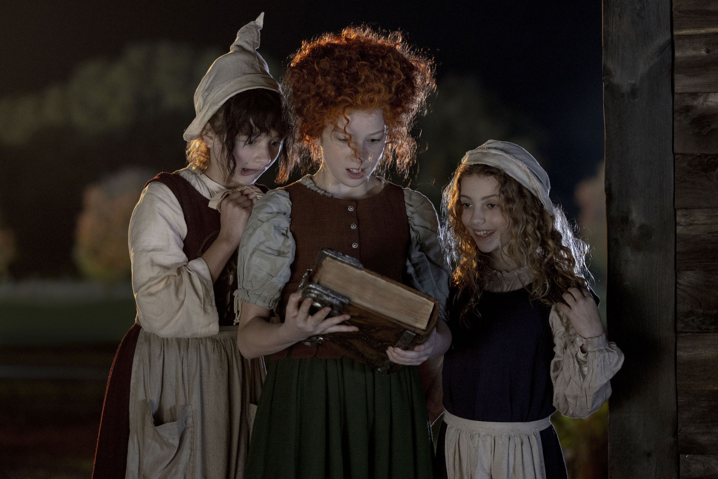 Nina Kitchen as Young Mary, Taylor Henderson as Young Winnie, and Juju Brener as Young Sarah in 'Hocus Pocus 2' (Matt Kennedy—Disney Enterprises, Inc.)