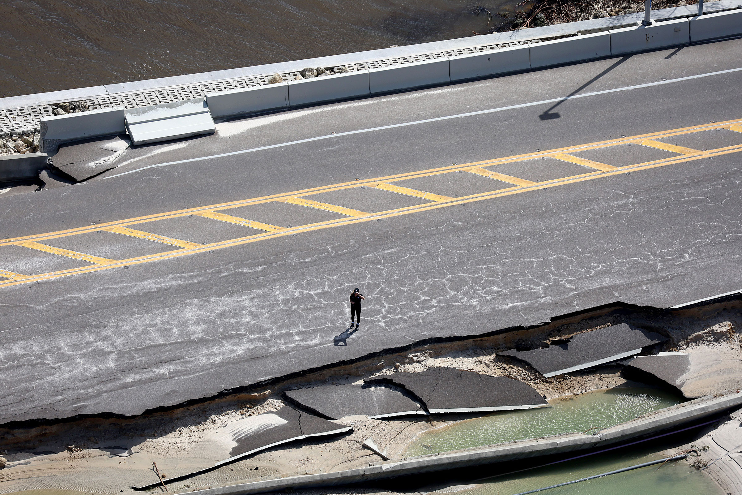 Parts of Sanibel Causeway are washed away along with sections of the bridge after Hurricane Ian passed through the area on Sept. 29 in Sanibel, Fla. (Joe Raedle—Getty Images)
