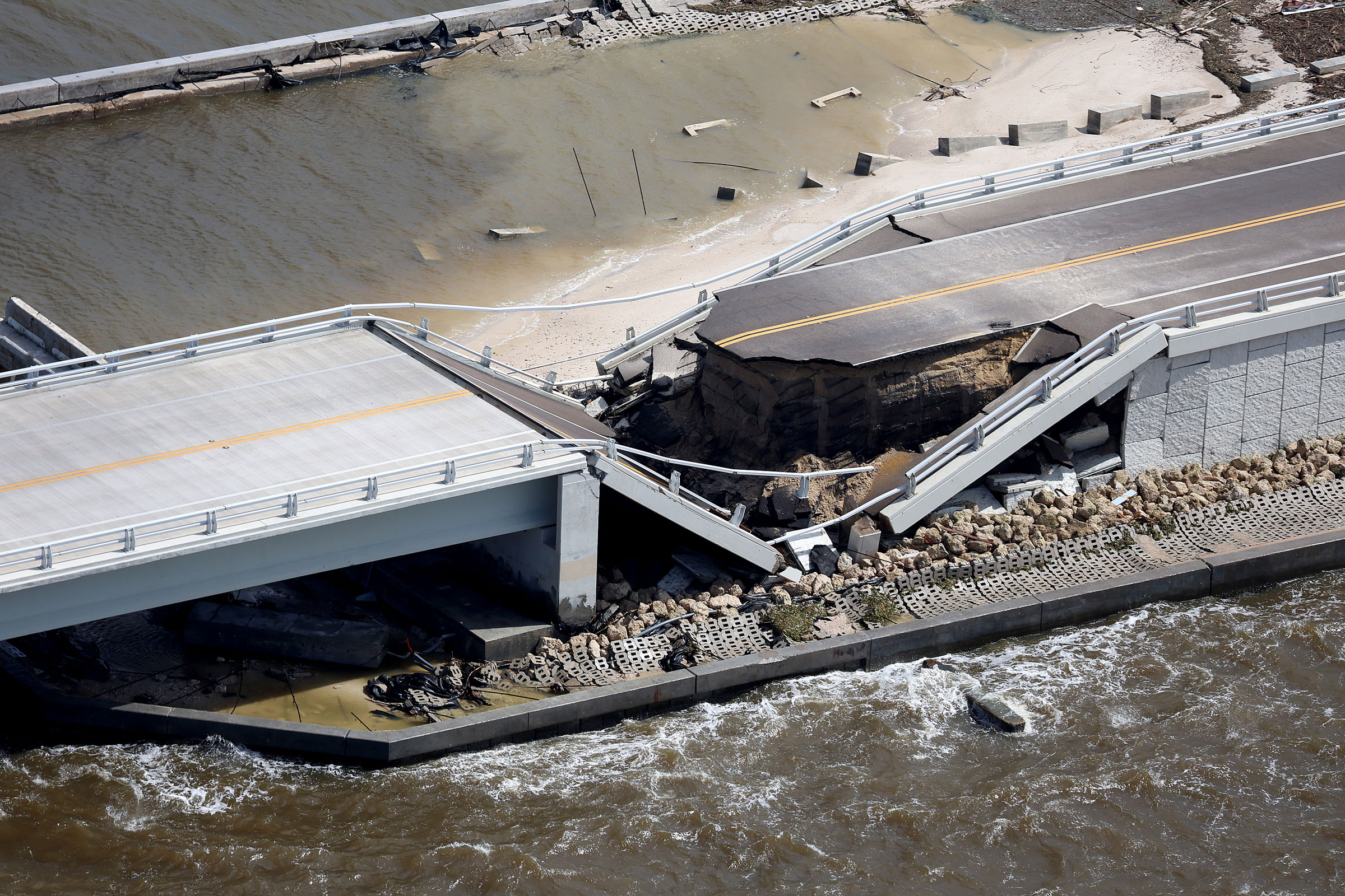 Parts of Sanibel Causeway are washed away along with sections of the bridge after Hurricane Ian passed through the area on Sept. 29, 2022, in Sanibel, Fla. (Joe Raedle—Getty Images)