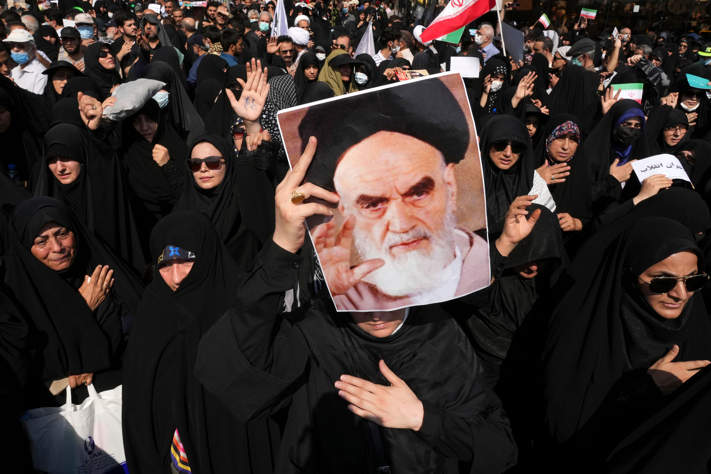 <b>Tehran, Iran </b>A pro-government demonstrator holds a poster of the late Iranian revolutionary founder Ayatollah Khomeini while attending a rally after the Friday prayers to condemn recent anti-government protests over the death of a young woman in police custody, in Tehran, Iran, Friday, Sept. 23, 2022. (Vahid Salemi—Ap)