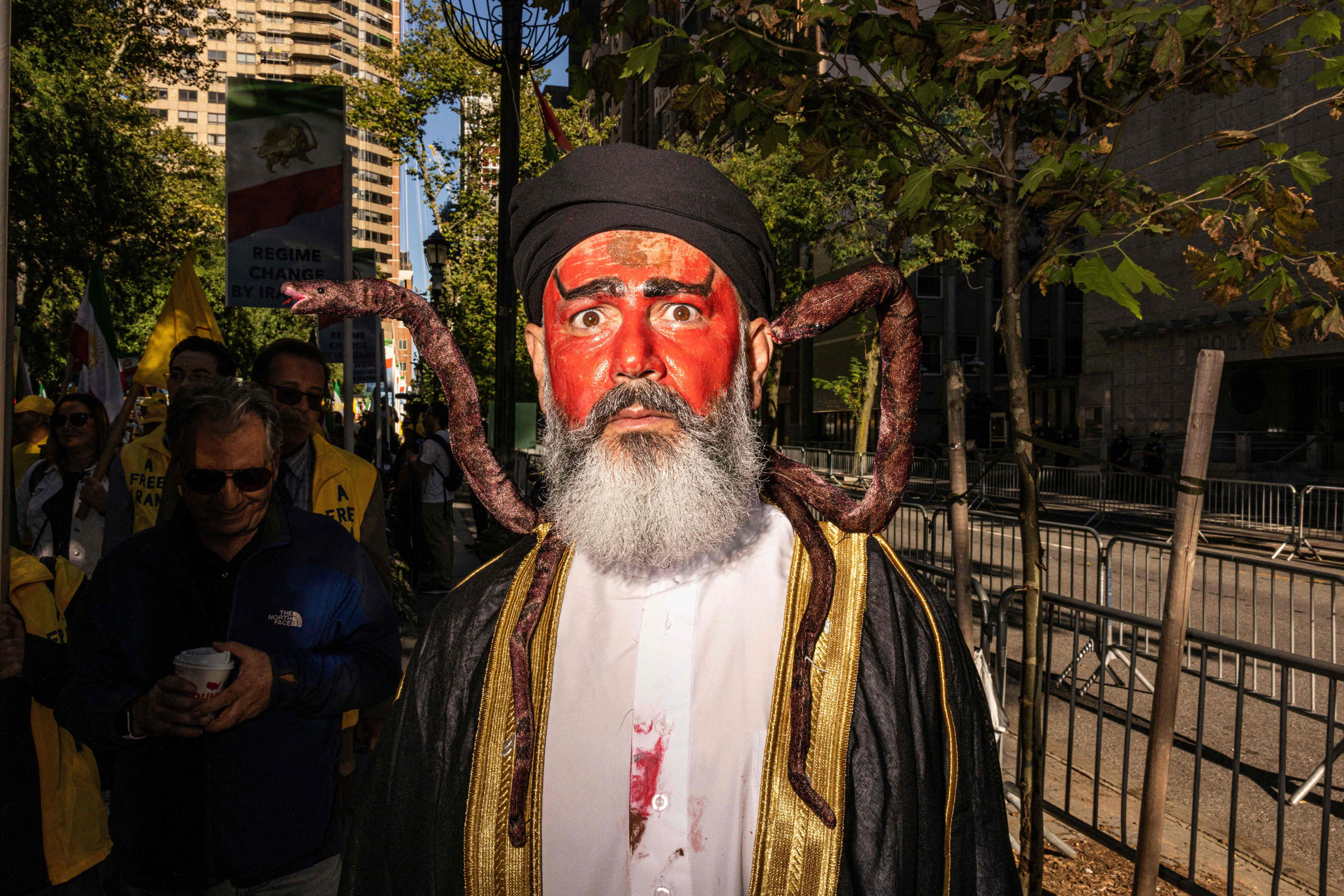 <b>New York, NY </b>A person dressed as Iranian President Ebrahim Rasi covered in blood with snakes on his shoulders participates in a protest against Iranian President Ebrahim Raisi during a rally in New York City on Sept. 21, 2022, amid the 77th session of the United Nations General Assembly. (Alex Kent—AFP/Getty Images)