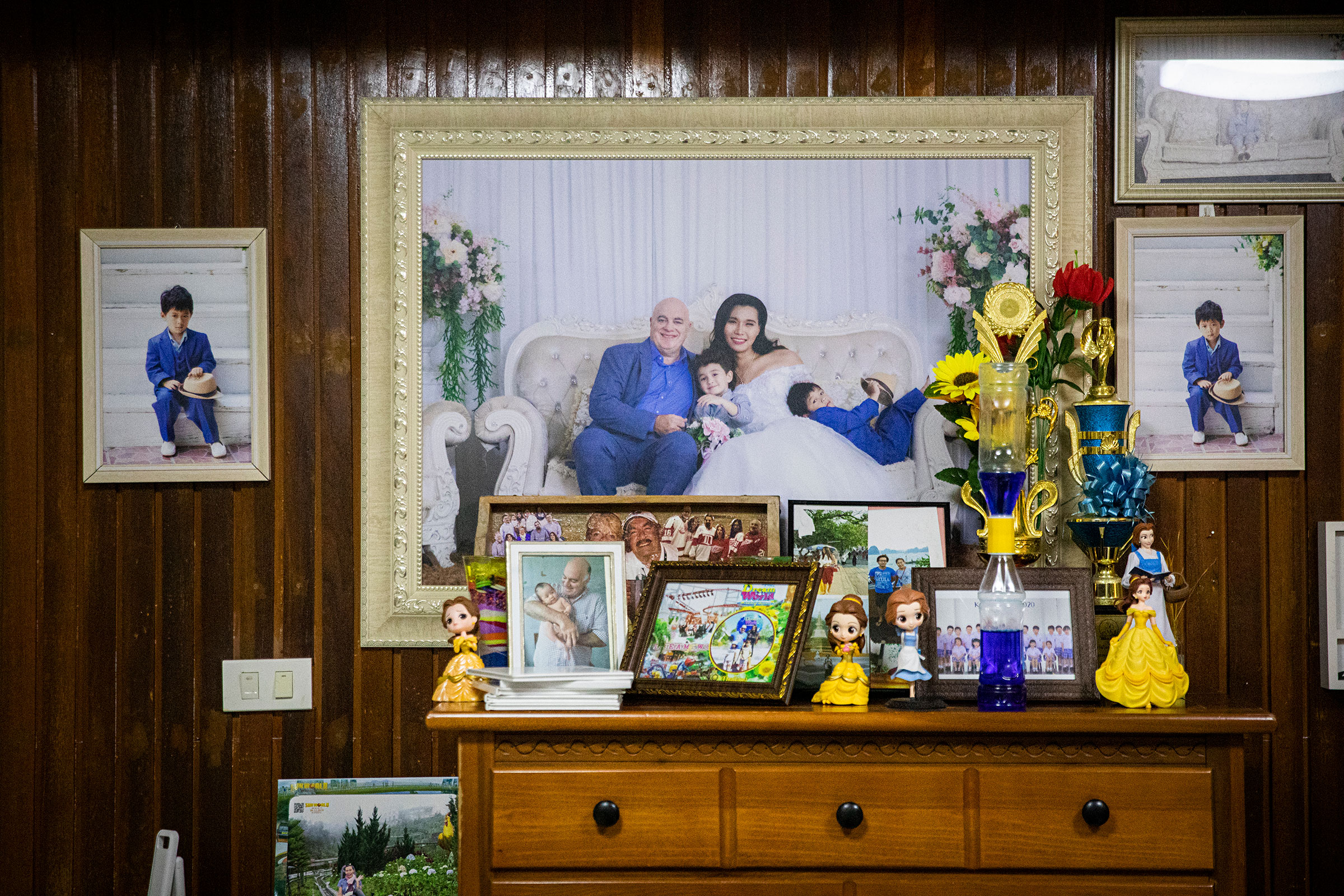 Family portraits hung on the walls of Gina and Lee's home. (Lauren DeCicca for TIME)