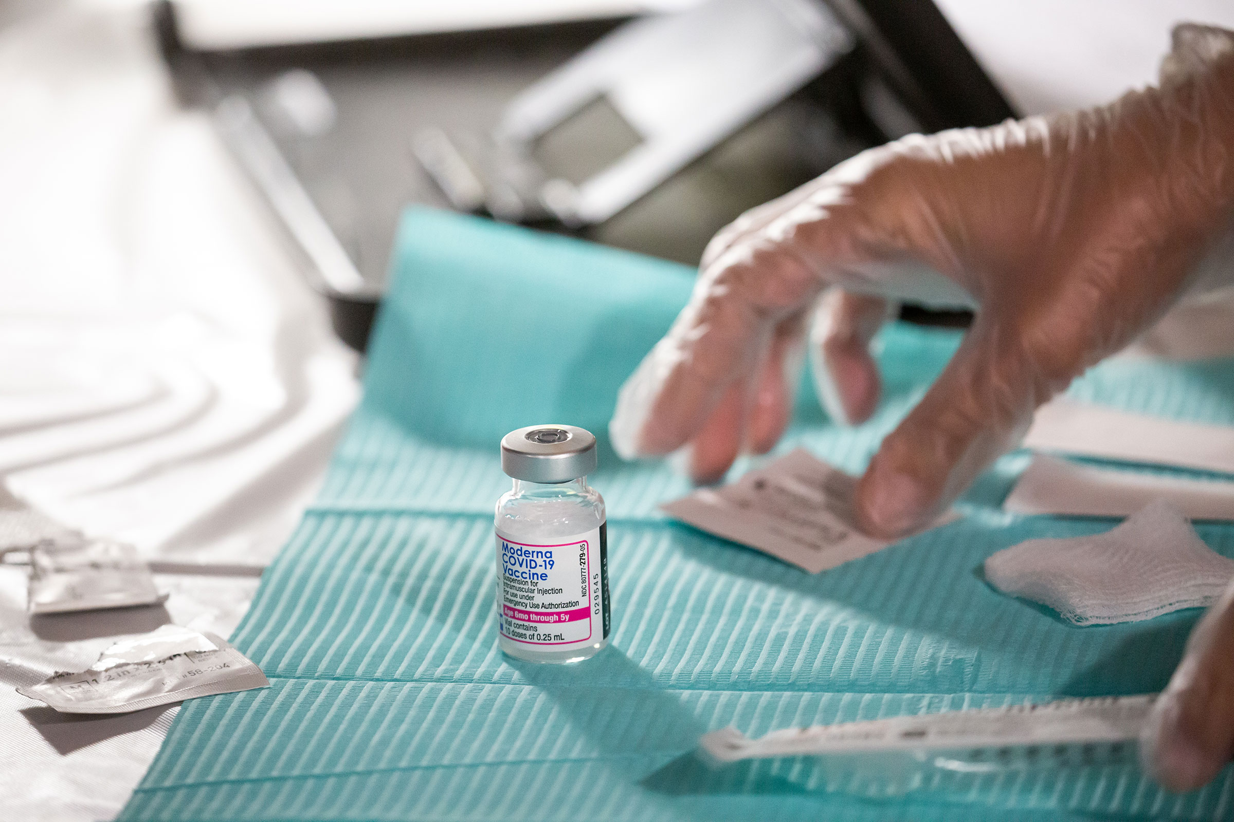 A health care worker prepares a dose of the Moderna COVID-19 vaccine at the Brooklyn Children's Museum vaccination site in New York City on June 23, 2022. (Michael Nagle—Bloomberg/Getty Images)