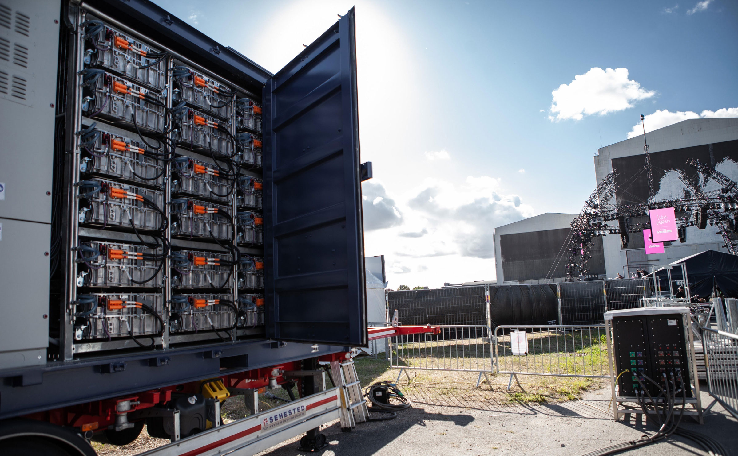 Electric truck batteries charged up with wind turbine energy parked outside of a Denmark concert venue. (Vestas Wind Systems A/S)