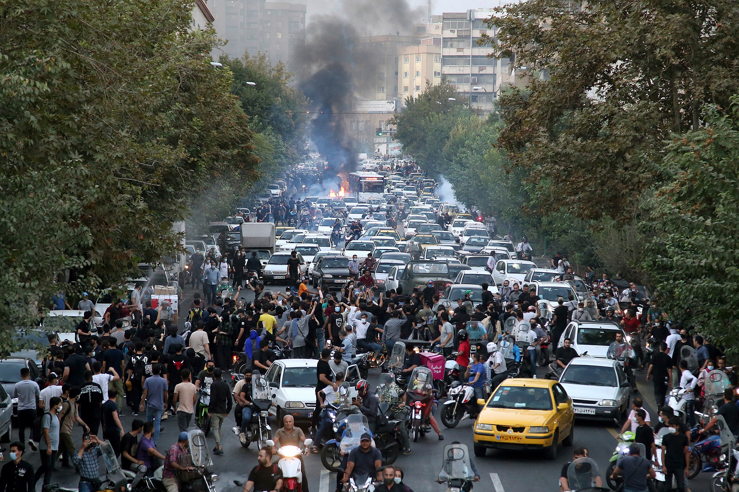 Protesters chant slogans over the death of a woman who was detained by the morality police, in downtown Tehran, Iran, on Sept. 21, 2022. (AP)