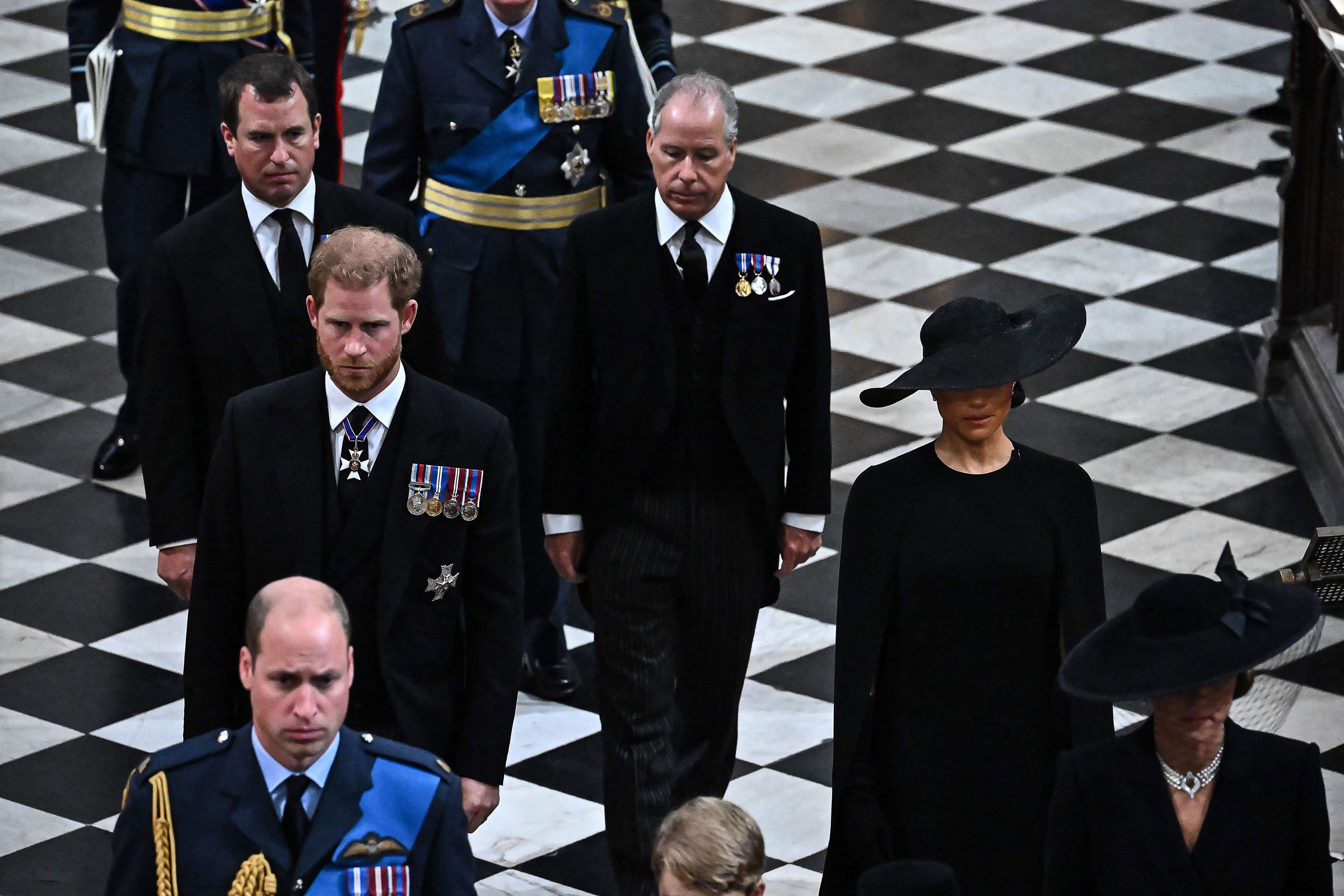 Peter Phillips (L), Britain's Prince Harry, Duke of Sussex (centre left), Britain's Prince William, Prince of Wales (bottom left), Britain's Earl of Snowdon (C) and Britain's Meghan, Duchess of Sussex (R) leave the Abbey at the State Funeral Service for Britain's Queen Elizabeth II, at Westminster Abbey in London on September 19, 2022.