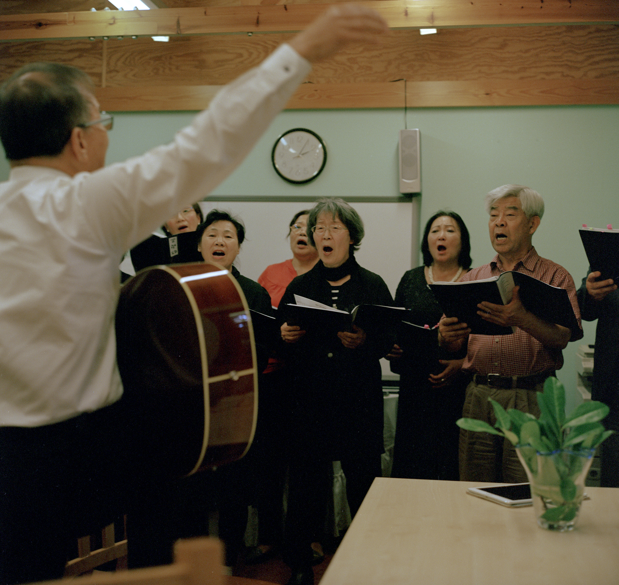 A group of South Koreans, North Koreans, and Korean Chinese sing together at the Korean Senior Citizens centre, New Malden, on Sept. 15. (Michael Vince Kim for TIME)