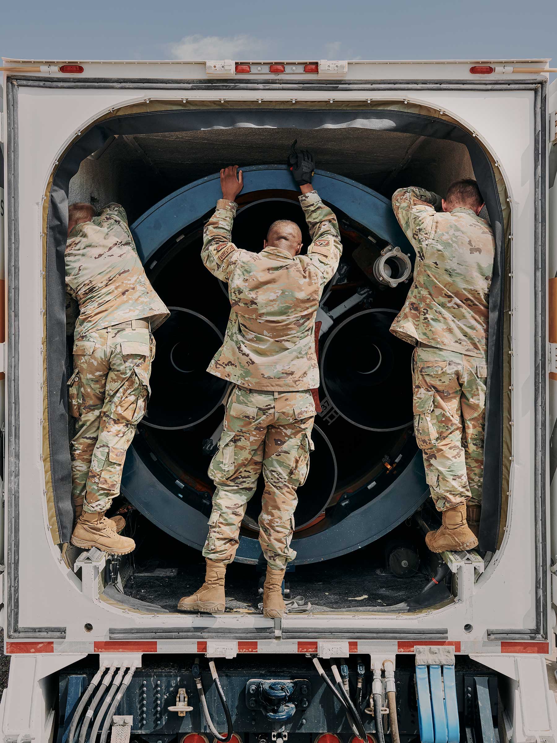 Preparing a Minuteman III to be lowered into the silo. (Benjamin Rasmussen for TIME)