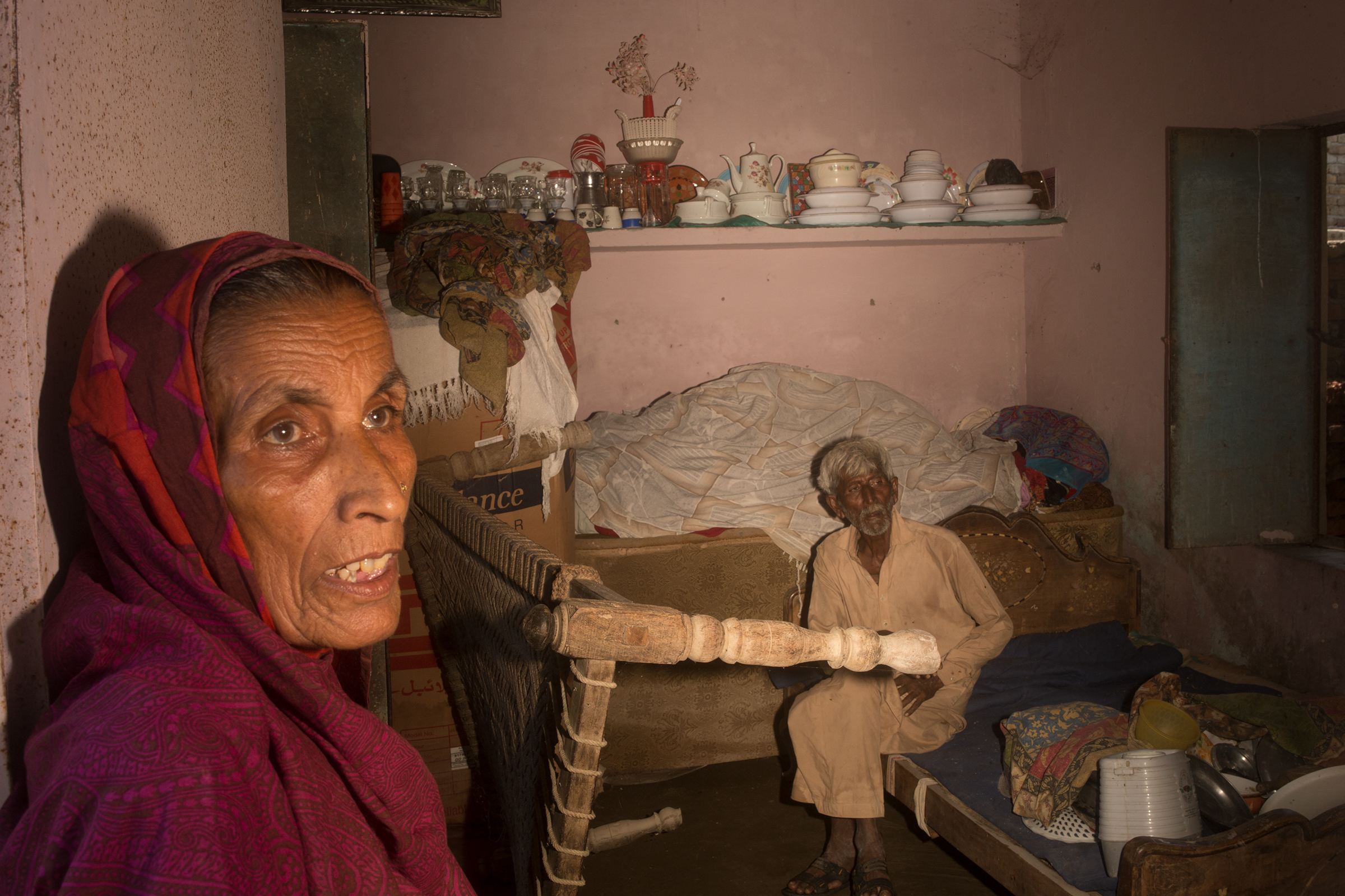 Bano and Abdul Ghani in their flooded house in Judo, September 9.  (Hasan Gondal for TIME)