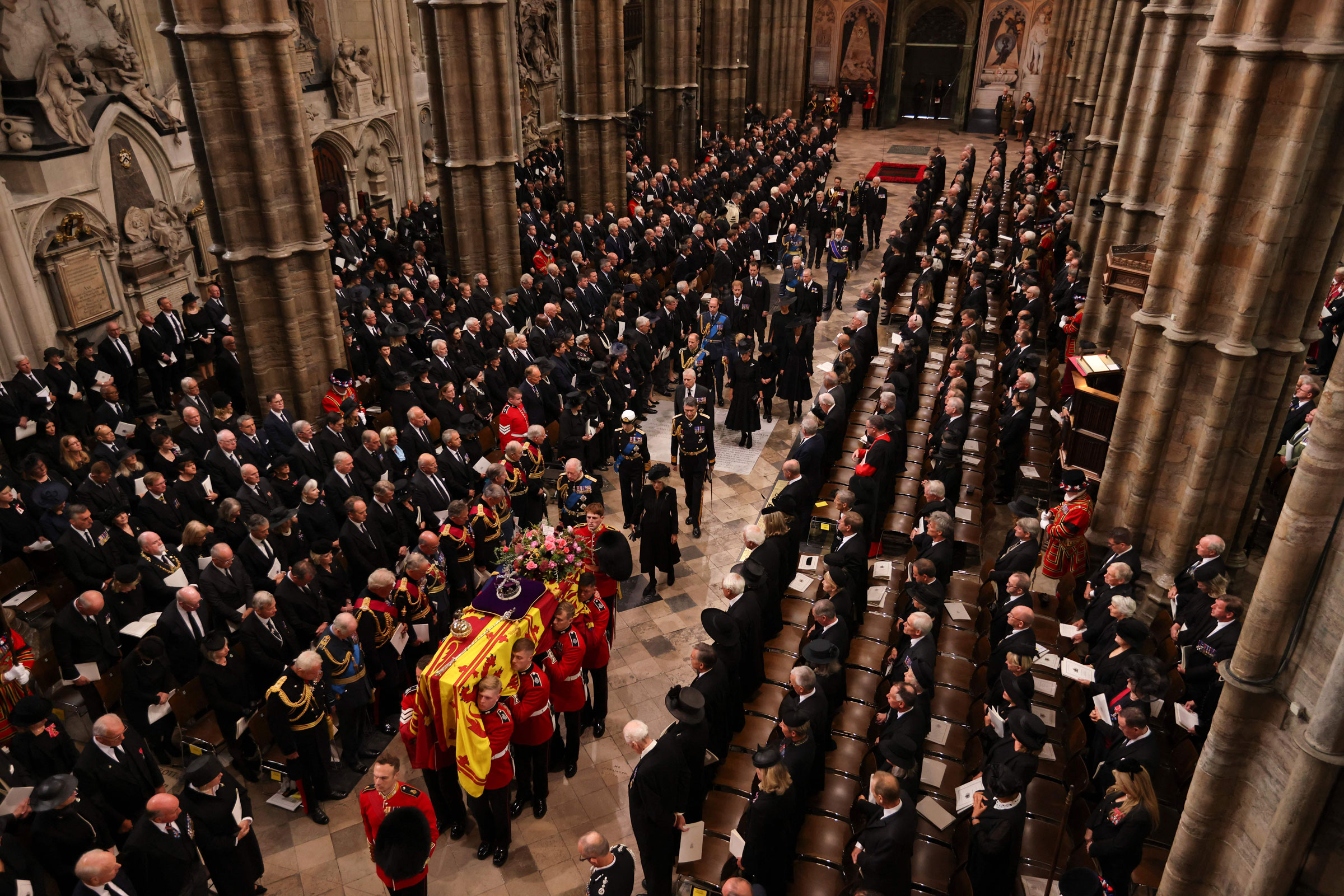 The bearer party carries the coffin of Queen Elizabeth II, draped in the royal standard, into Westminster Abbey in London on Sept. 19, 2022, ahead of the state funeral service. (Jack Hill—Pool/AFP/Getty Images)