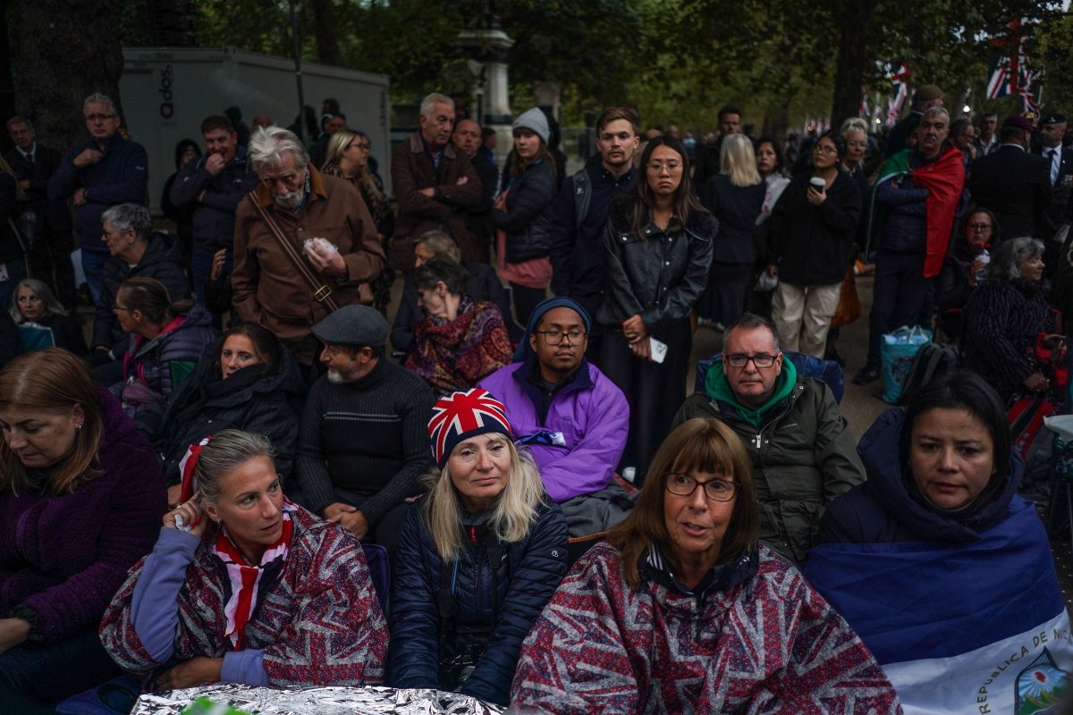 Members of the public wait on the Mall ahead of the State Funeral of Queen Elizabeth II
