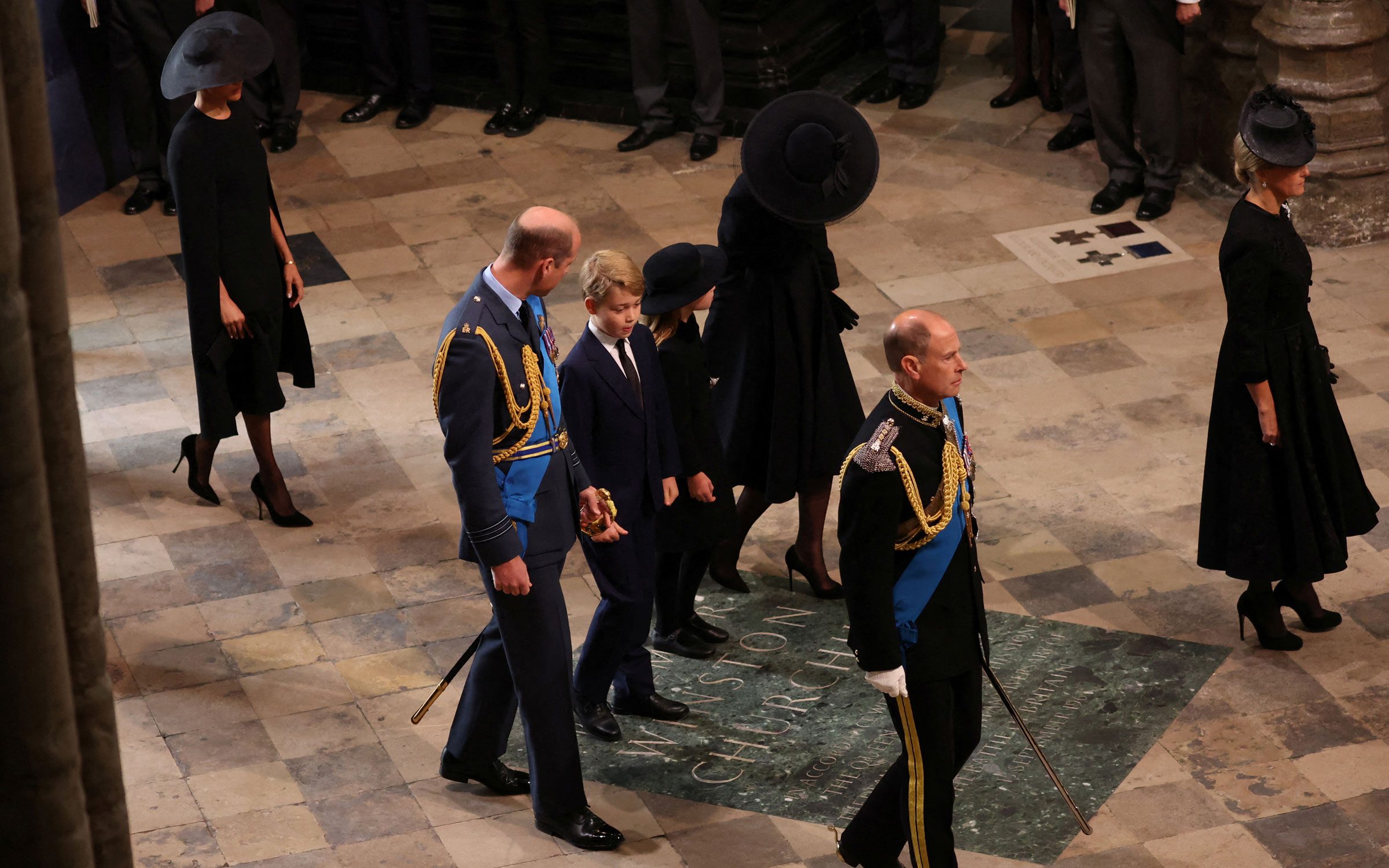 Britain's William (L), Prince of Wales, his children Prince George and Princess Charlotte and Catherine, Princess of Wales, arrive for the state funeral and burial of Britain's Queen Elizabeth II.