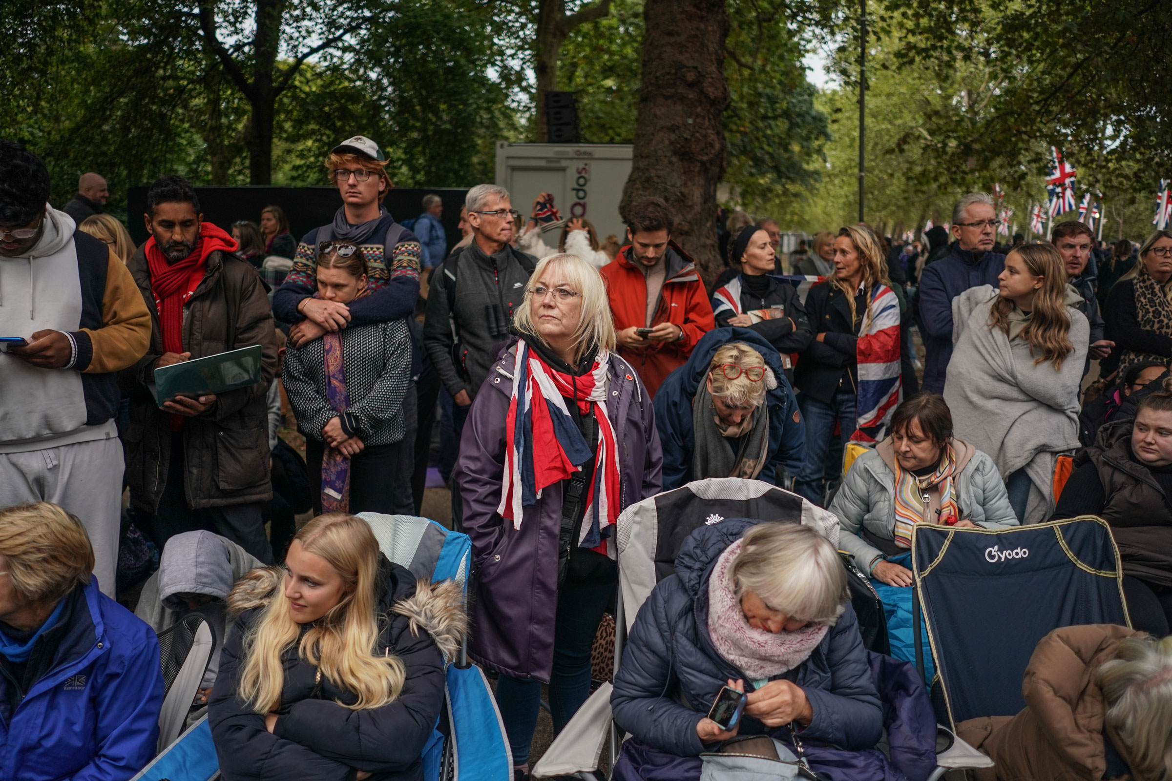 Members of the public wait on the Mall ahead of the State Funeral of Queen Elizabeth II at Westminster Abbey on September 19, 2022 in London, England. (Peter Summers—Getty Images)