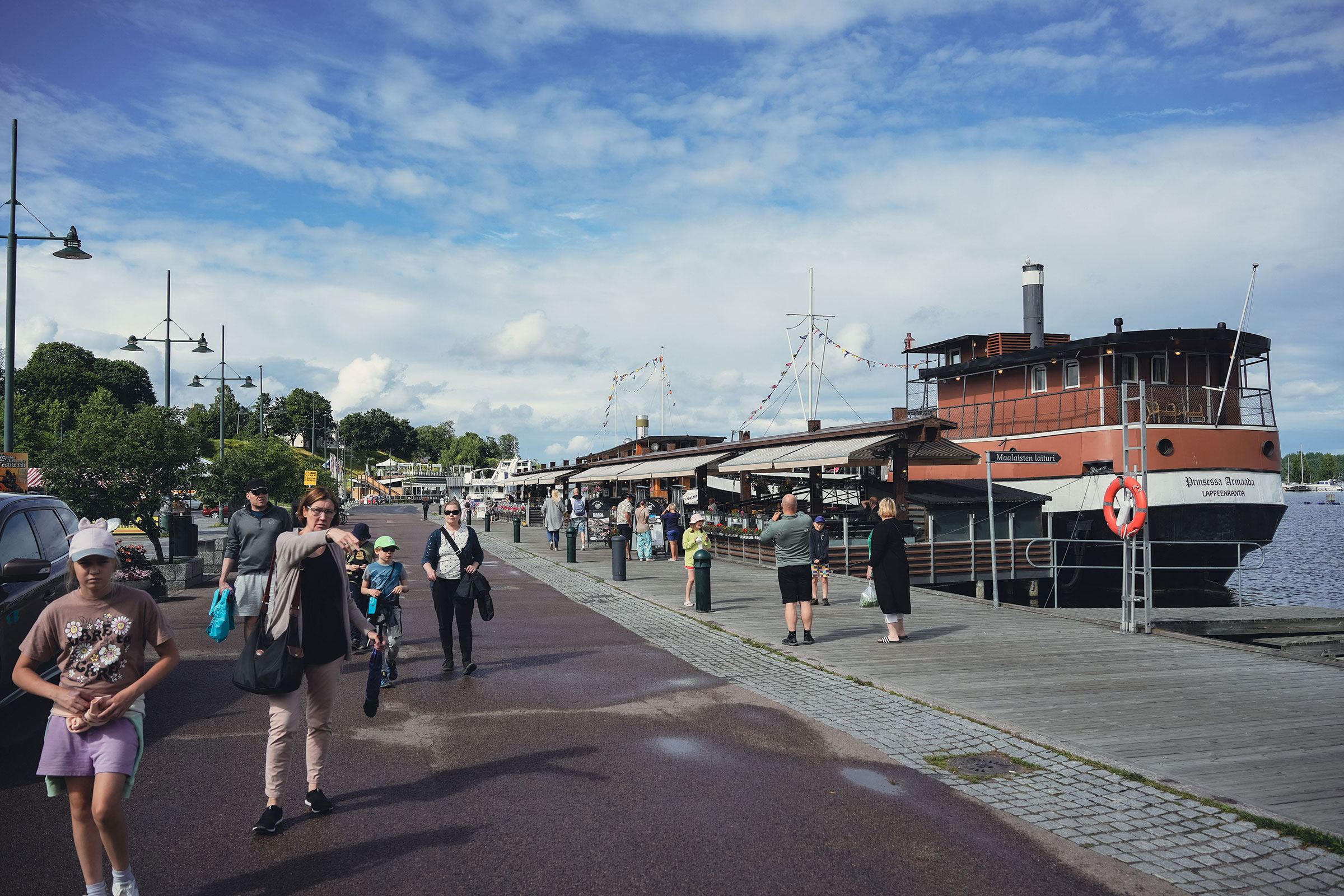 At the Nuijamaa border crossing in Lappeenranta, buses of Russian tourists stream into Finland. Some are looking to enjoy the Finnish summer and some are planning to travel further into Europe. (Alessandro Rampazzo—AFP/Getty Images)