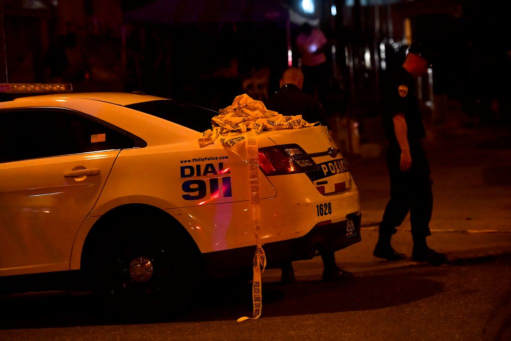 Yellow police tape drapes from a vehicle as police respond to a shooting on Aug. 14, 2019 in Philadelphia. (Mark Makela—Getty Images)