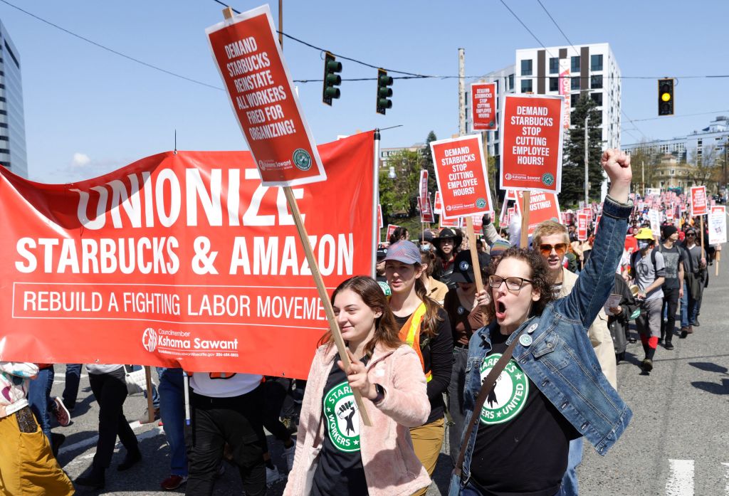 People march during the "Fight Starbucks' Union Busting" rally and march in Seattle, Wash., on April 23, 2022. (Jason Redmond/AFP—Getty Images)