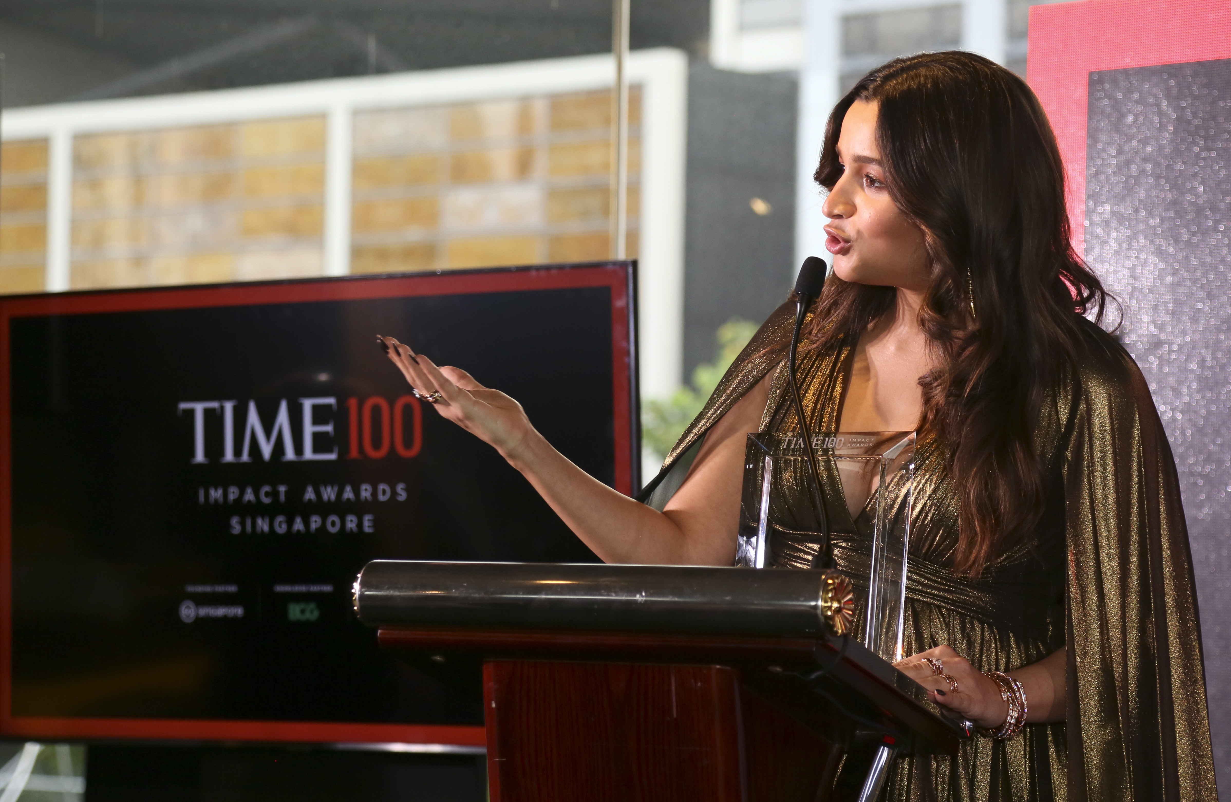 Actor and producer Alia Bhatt speaks after receiving a TIME100 Impact Award on Oct. 02, 2022 in Singapore. (Ore Huiying—Getty Images for TIME)