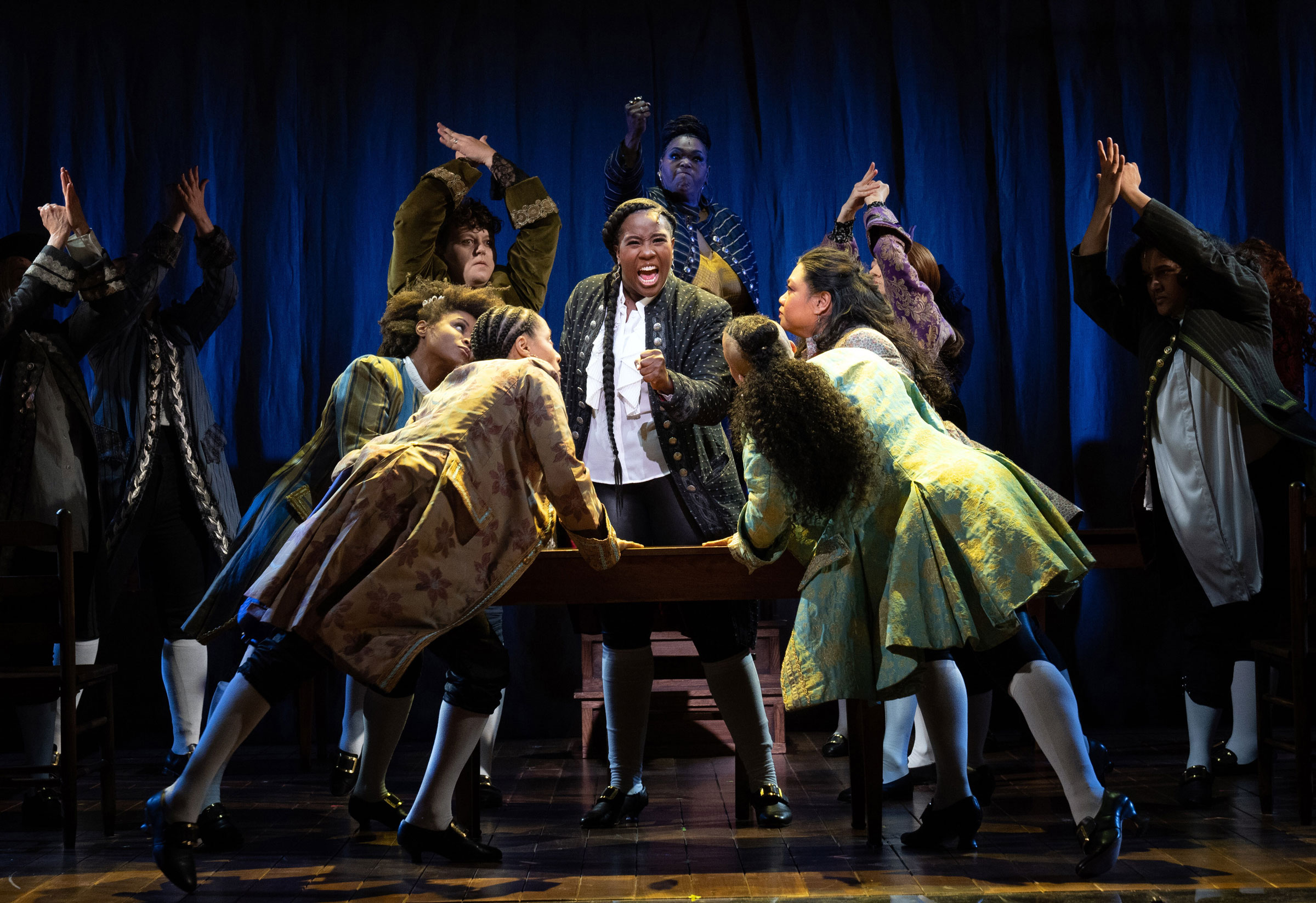 Crystal Lucas-Perry, center, as John Adams in "1776," in which the performers identify as female, transgender and nonbinary, at the American Airlines Theater in New York, Sept. 15, 2022. (Sara Krulwich—The New York Times/Redux)
