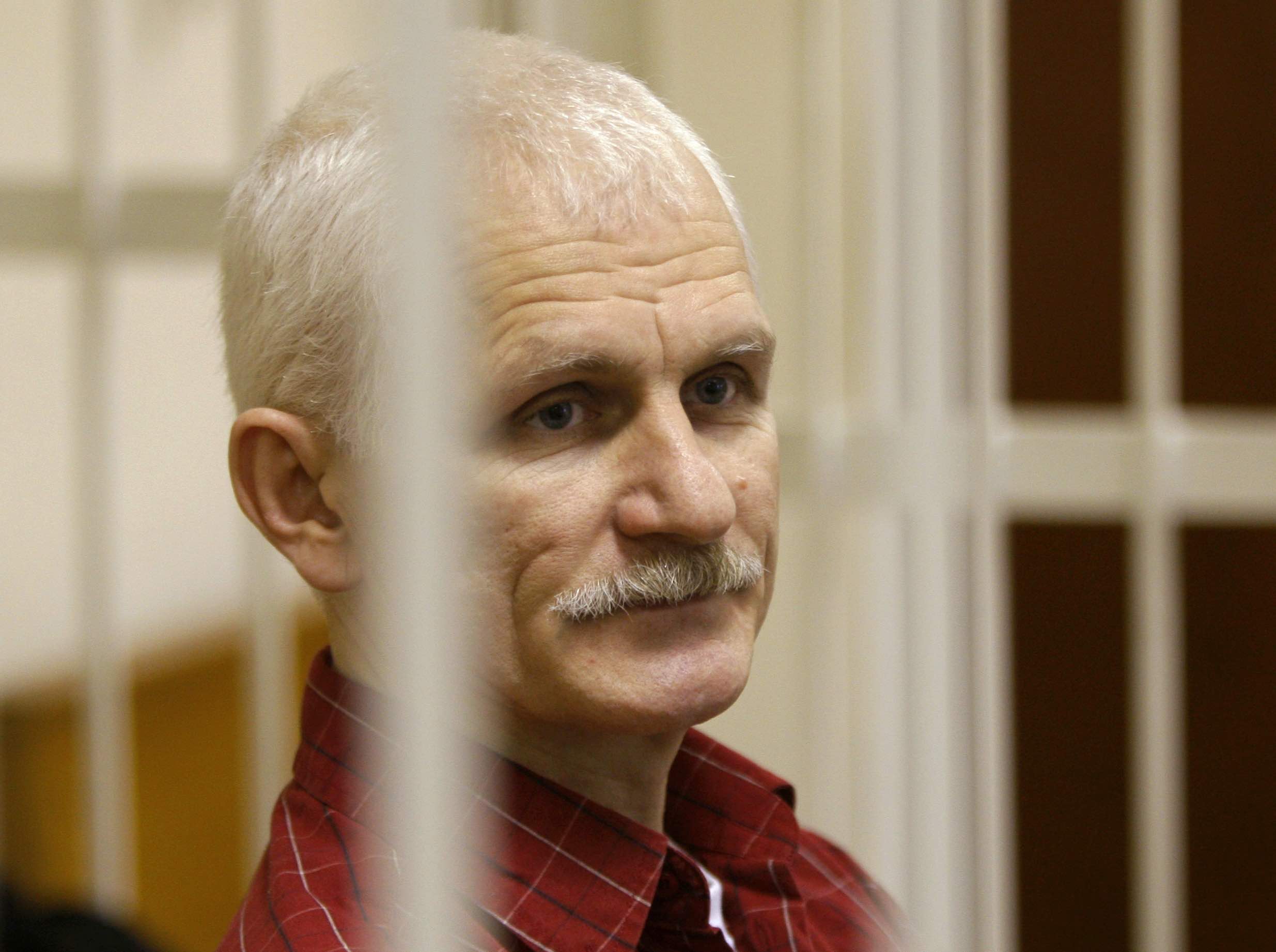 Ales Bialiatski, the head of Belarusian Vyasna rights group, stands in a defendants' cage during a court session in Minsk, Belarus, on Wednesday, Nov. 2, 2011. On Friday, Oct. 7, 2022 the Nobel Peace Prize was awarded to jailed Belarus rights activist Ales Bialiatski, the Russian group Memorial, and the Ukrainian organization Center for Civil Liberties. (Sergei Grits—AP Photo)