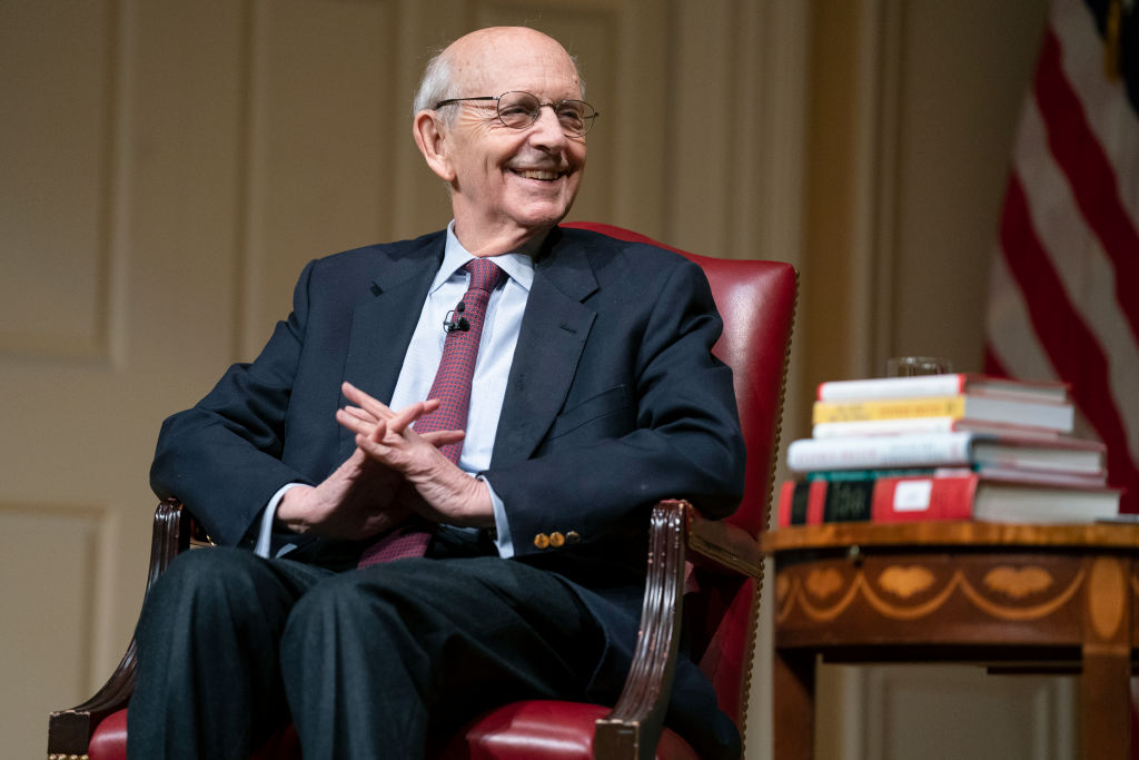 Supreme Court Justice Stephen Breyer smiles during an event at the Library of Congress for the 2022 Supreme Court Fellows Program hosted by the Law Library of Congress on February 17, 2022 in Washington, DC. (Evan Vucci—Pool/Getty Images)