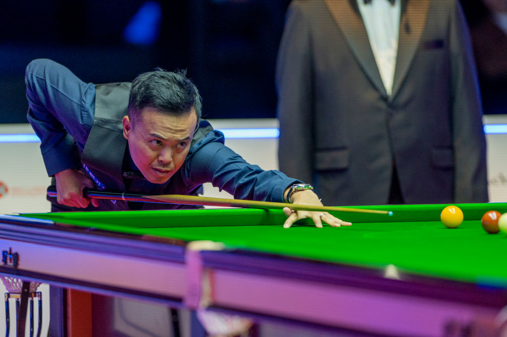 Marco Fu of Hong Kong plays a shot during the Hong Kong Masters 2022 Quarter Final match against Mark Selby of England at Hong Kong Coliseum on Oct. 06, 2022. (Stephen Law—Eurasia Sport Images/Getty Images)