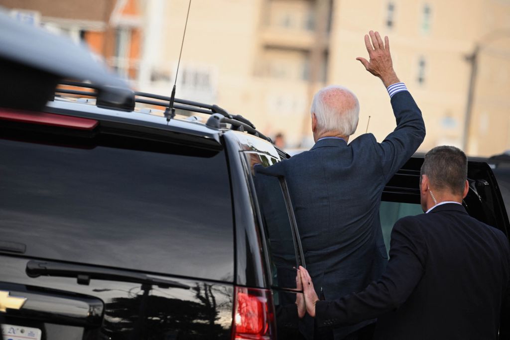 President Joe Biden waves as he leaves Saint Edmond Roman Catholic Church after attending Mass in Rehoboth Beach, Del., on October 22, 2022. (Mandel Ngan—AFP via Getty Images)