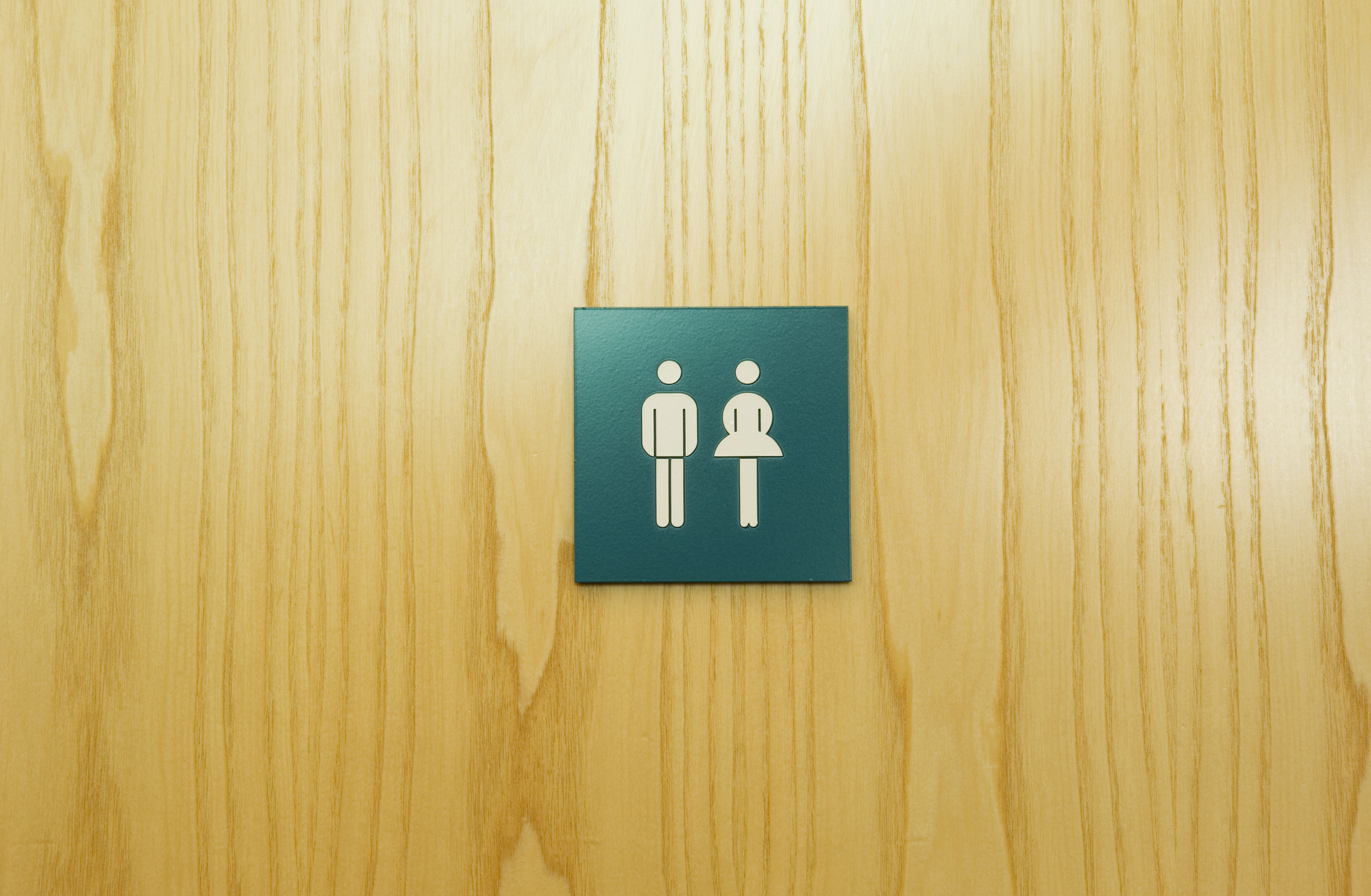 Male and female toilet sign on door
