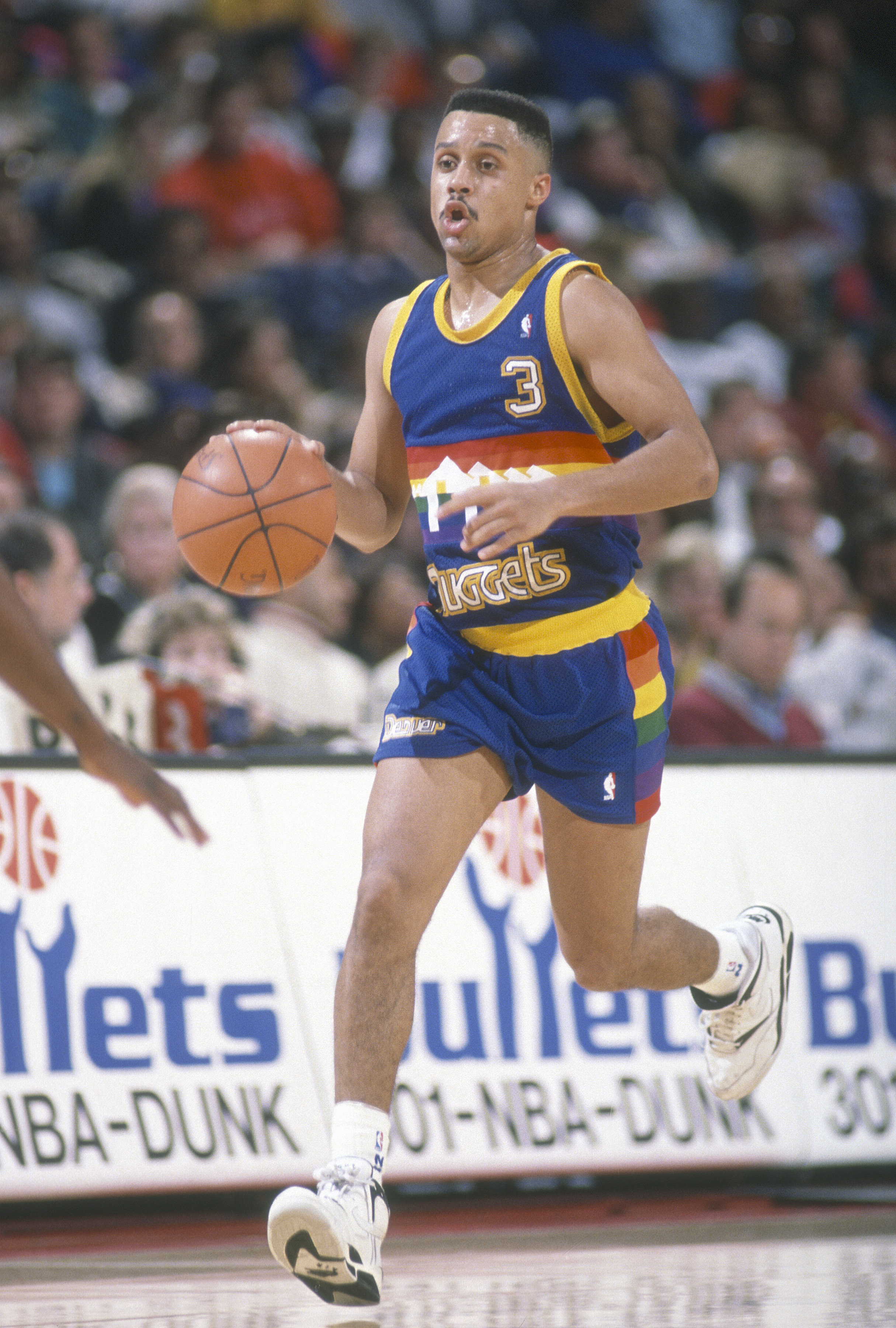 Mahmoud Abdul-Rauf  #3 of the Denver Nuggets dribbles the ball up court against the Washington Bullets during an NBA basketball game circa 1991 at the Capital Centre in Landover, Maryland. Abdul-Rauf played for the Nuggets from 1990-96. (Photo by Focus on Sport—Getty Images)