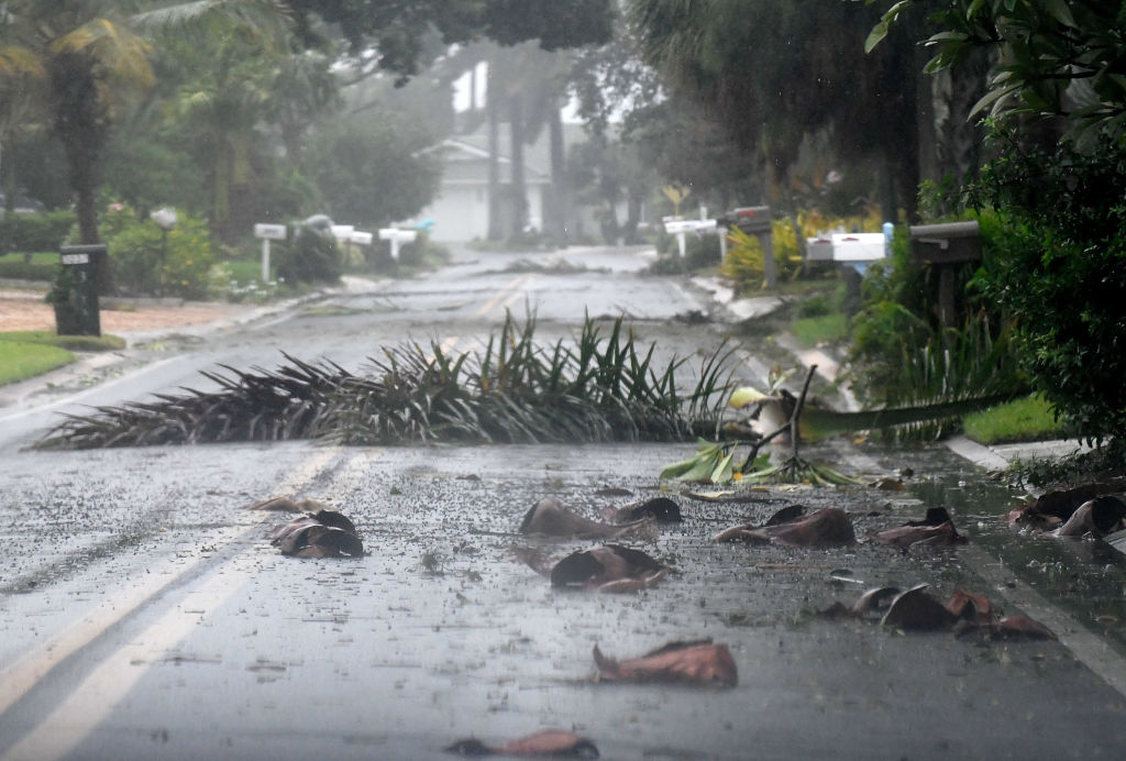 Debris litters a street in a neighborhood of St. Pete Beach as the winds from Hurricane Ian arrive  in St. Petersburg, Florida, on September 28, 2022. (Gerardo Mora—Getty Images)