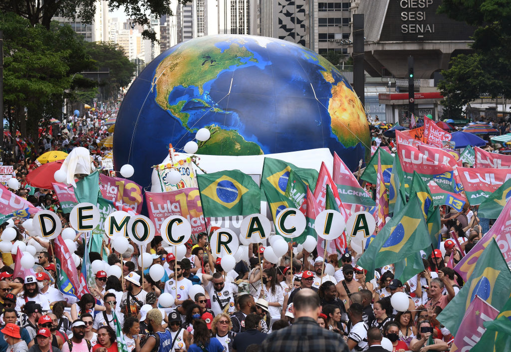 Supporters of former president of Brazil and presidential candidate Luiz Inacio Lula da Silva attend his final rally before the election on Oct. 29, 2022 in Sao Paulo, Brazil. (Daniel Munoz—VIEWpress/Corbis/Getty Images)