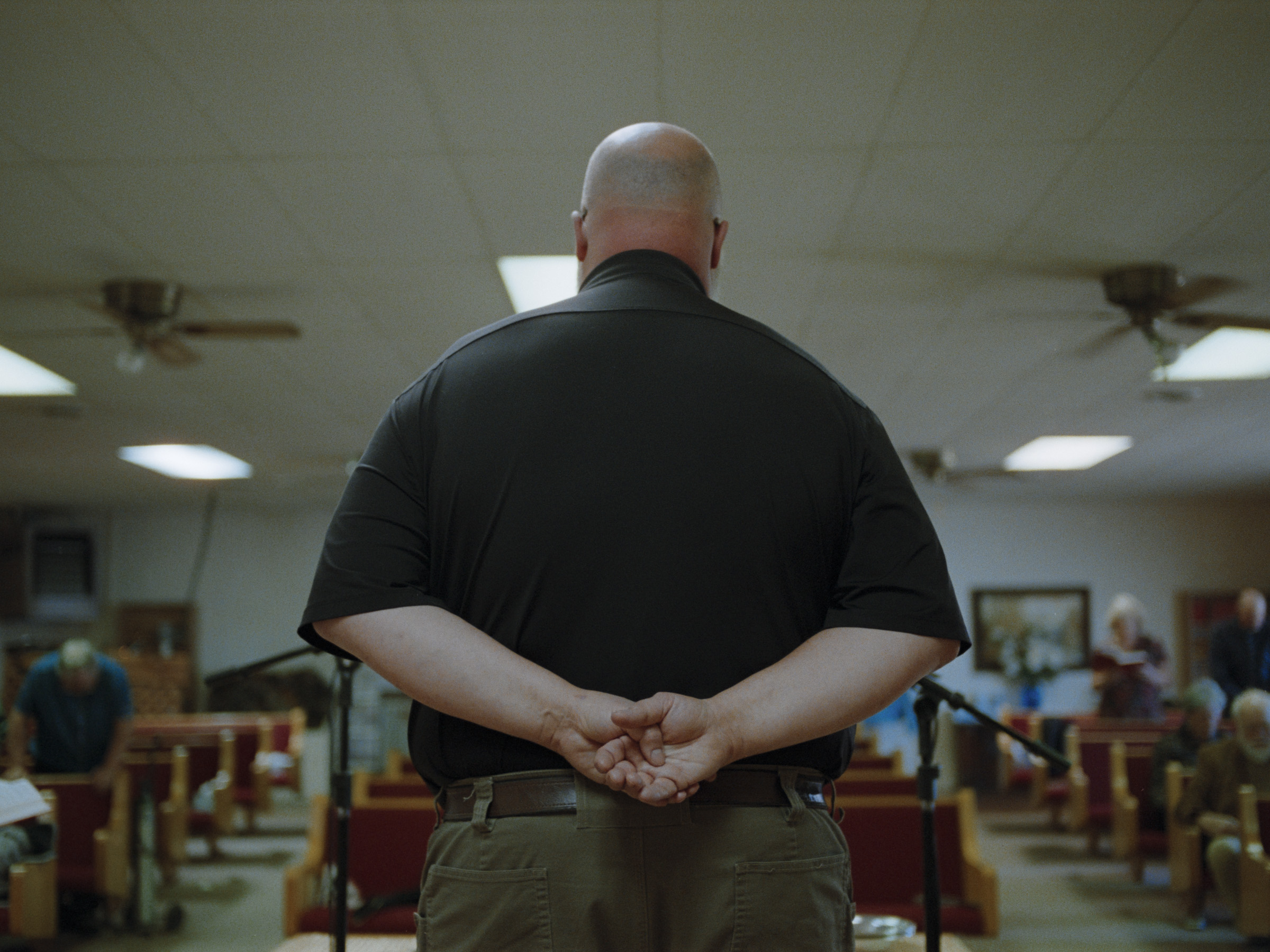Rusty Stewart, 47, a pastor at the First Baptist Church of Quemado, used to wear a gun on his hip that he described as his “backup plan.” After a suicide attempt, he was placed under observation at a hospital and told that “people who commit suicide go straight to hell,” he remembers. Stewart now uses his position at the pulpit to try to dispel stigma about mental health. “I think most depressed, suicidal people are probably closer to God than most Christians. I know because they’re the ones that are really reaching out for help.” (Brandon Kapelow)