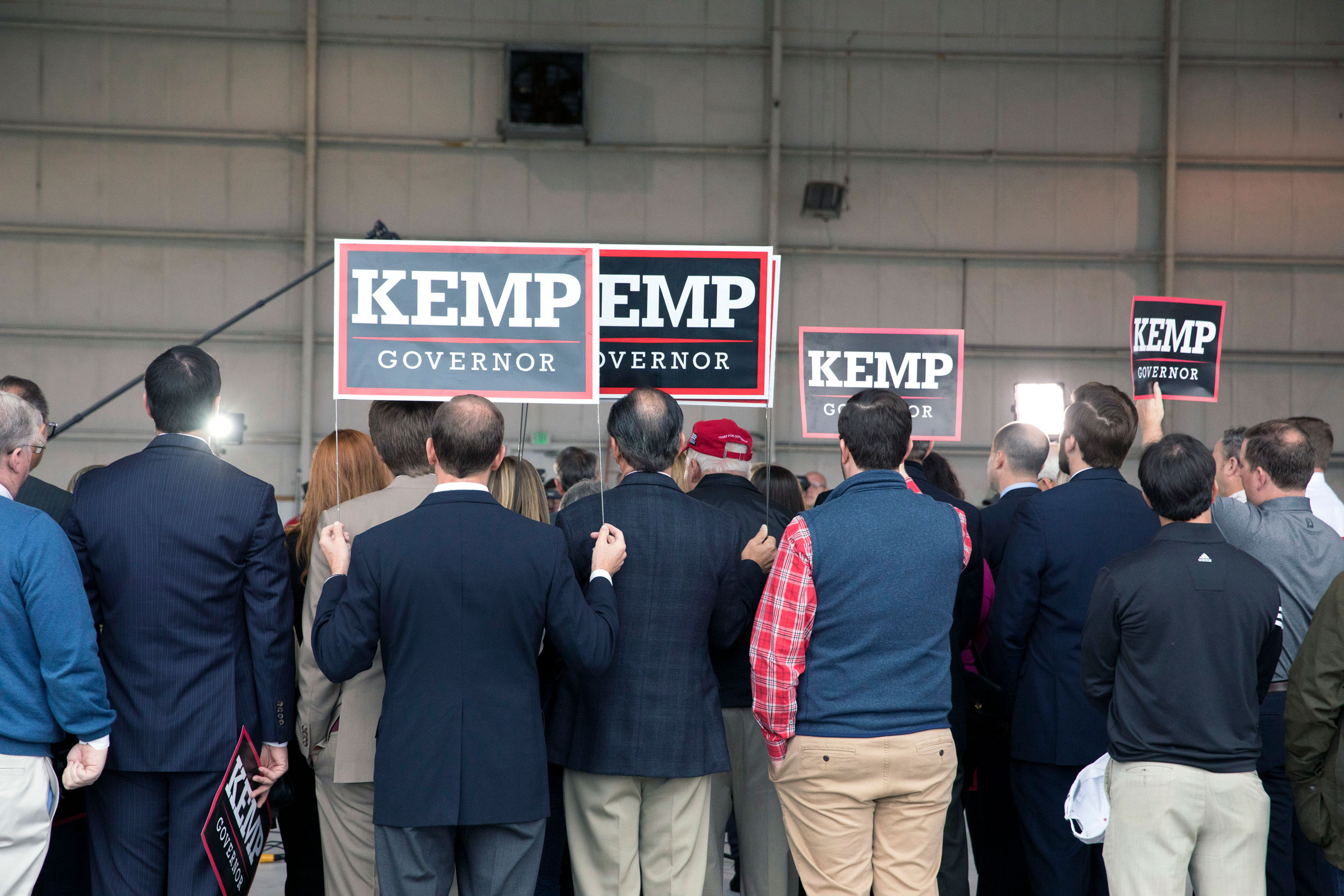 Supporters gather at a campaign rally for Brian Kemp, the Georgia secretary of state and Republican candidate for governor, at the DeKalb-Peachtree Airport in Chamblee, Ga., on Monday morning, Nov. 5, 2018.