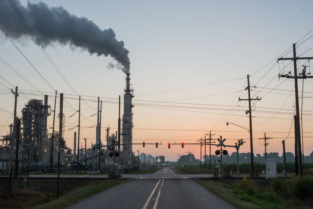 Smoke billows from one of many chemical plants in the area Oct. 12, 2013. 'Cancer Alley' is one of the most polluted areas of the United States and lies along the once pristine Mississippi River that stretches some 80 miles from New Orleans to Baton Rouge, where a dense concentration of oil refineries, petrochemical plants, and other chemical industries reside alongside suburban homes. (Giles Clarke—Getty Images)