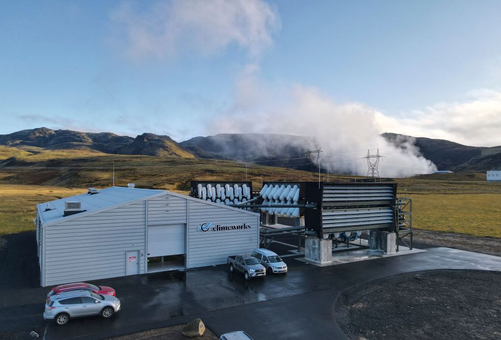 Climeworks factory with it's fans in front of the collector, drawing in ambient air and release it, as largely purified CO2 through ventilators at the back is seen at the Hellisheidi power plant near Reykjavik on Oct. 11, 2021. (HALLDOR KOLBEINS/AFP—Getty Images)