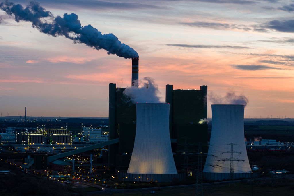 Exhaust gases rise from the chimney of Uniper's Schkopau lignite power plant on Dec. 17, 2019 near Halle, Germany. The German federal government and Germany's 16 states had greed on a new scheme of carbon pricing, set to rise to EUR 25 per ton of emitted CO2 by 2021 and to EUR 55 by 2025. (Jens Schlueter—Getty Images)