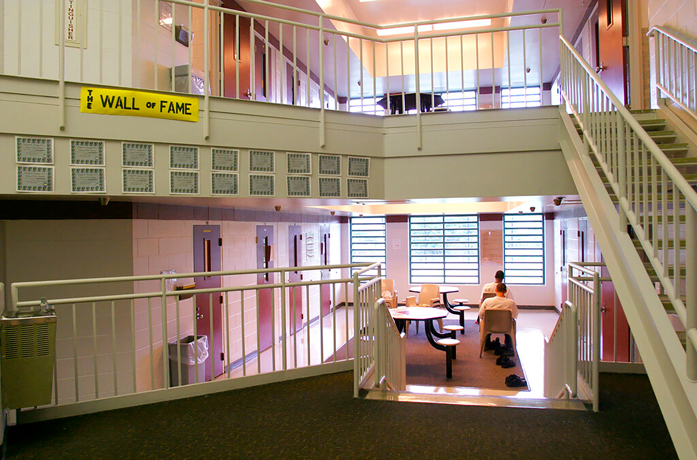 In this May 18, 2004 photo, inmates sit in one of the cottages at the Circleville Juvenile Correctional Facility in Circleville, Ohio. A report released Friday April 23, 2021 that looked at the death of 17-year-old Robert Wright in August of 2020, indicated that two juvenile prison guards slept while on duty. One of them failed to properly conduct overnight rounds, and two others failed to conduct timely CPR on the Ohio youth found unresponsive who later died, according to an investigation into the youth's death. (Tim Revell—The Columbus Dispatch/AP)