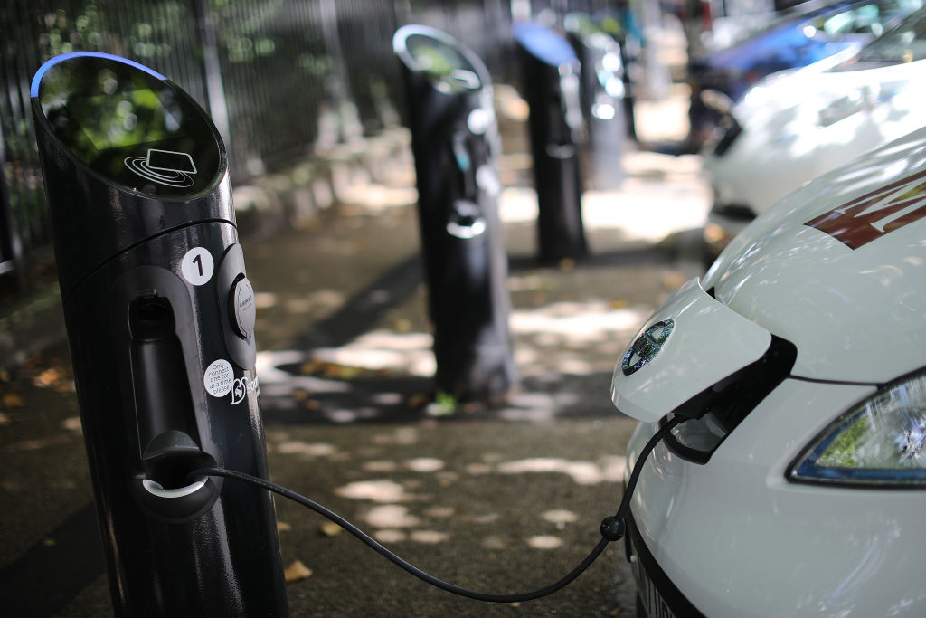 A charging plug connects an electric vehicle to a charging station on Aug. 17, 2017 in London, England. (Dan Kitwood—Getty Images)
