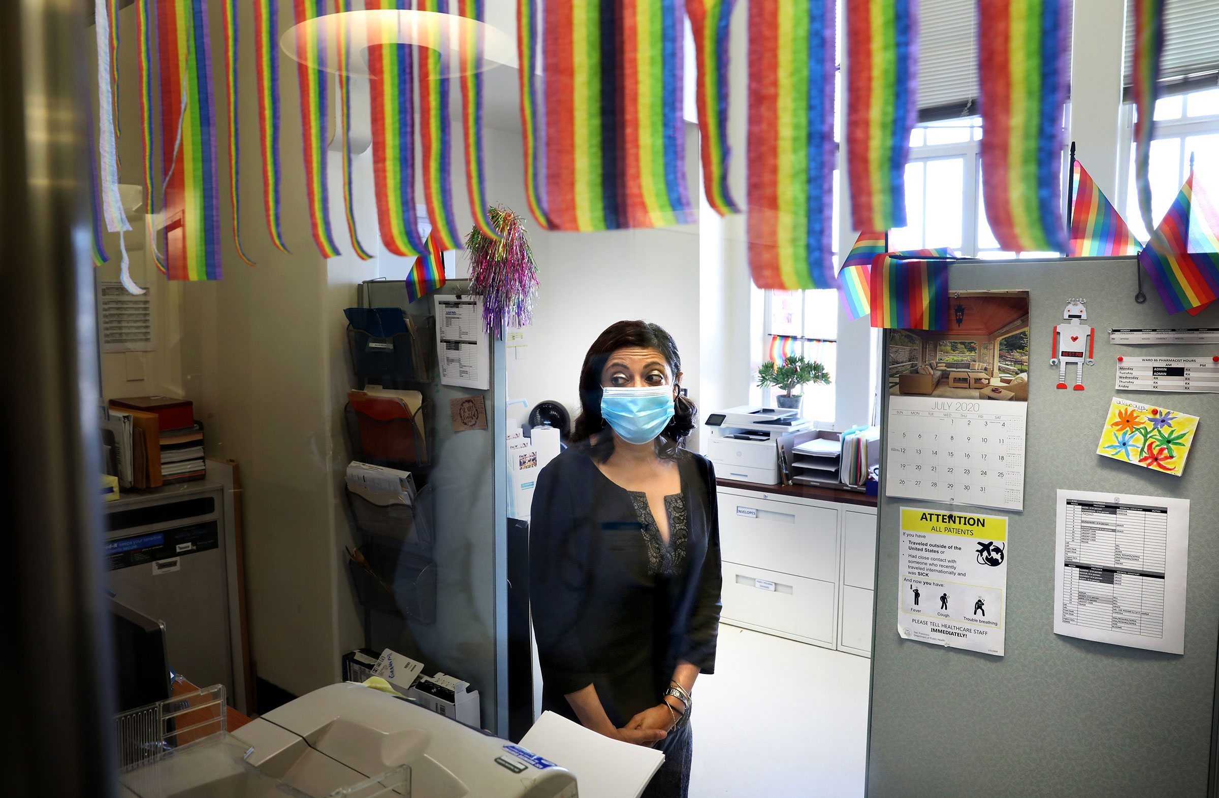 Medical director of Ward 86 at San Francisco General, Monica Gandhi, watches as patients get off the elevator, on July 2, 2020. (Liz Hafalia—The San Francisco Chronicle/Getty Images)