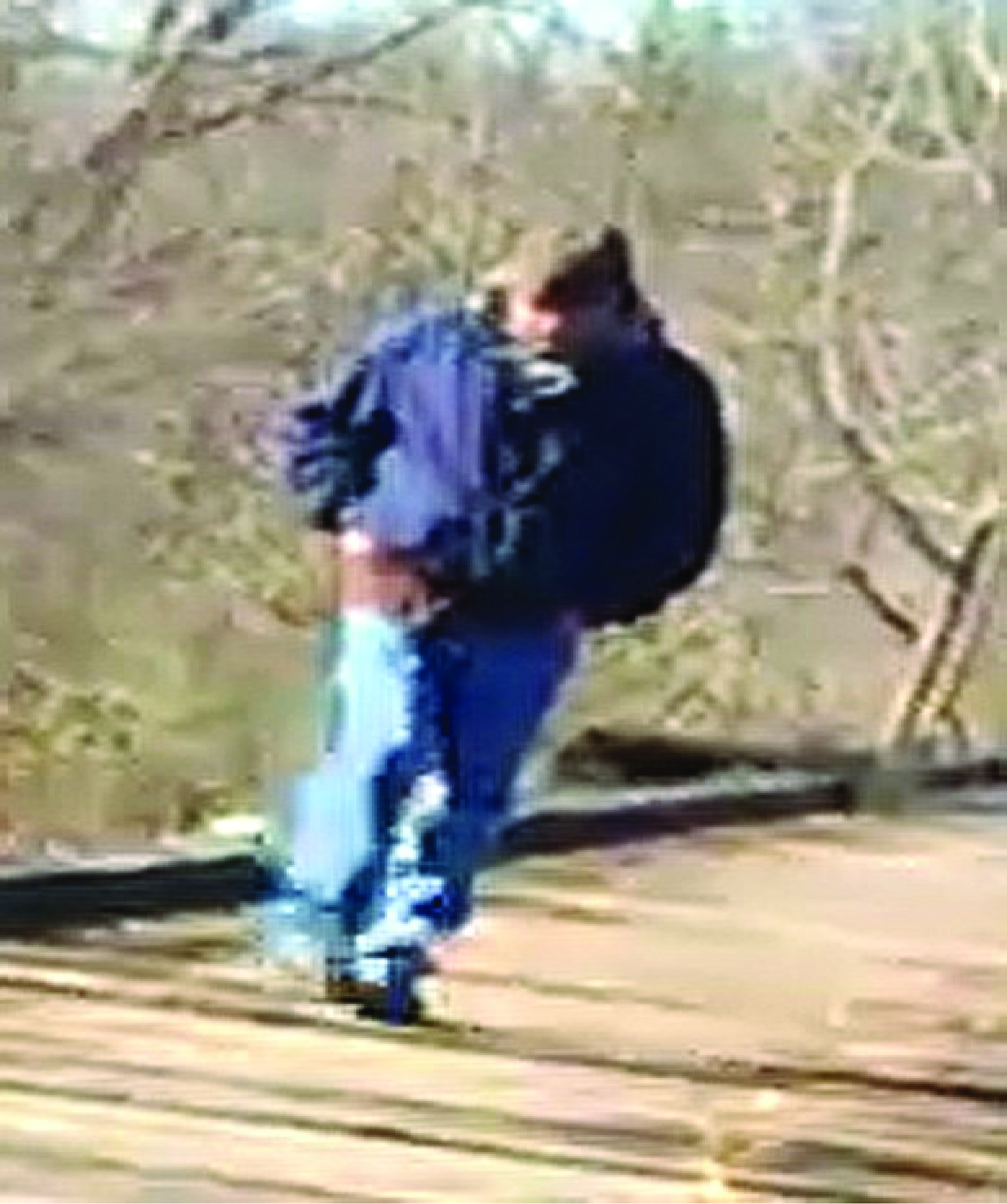 A photograph, distributed by law enforcement officers, of a person observed on the Delphi Historic Trail around the time Abby and Libby were killed. (Indiana State Police)