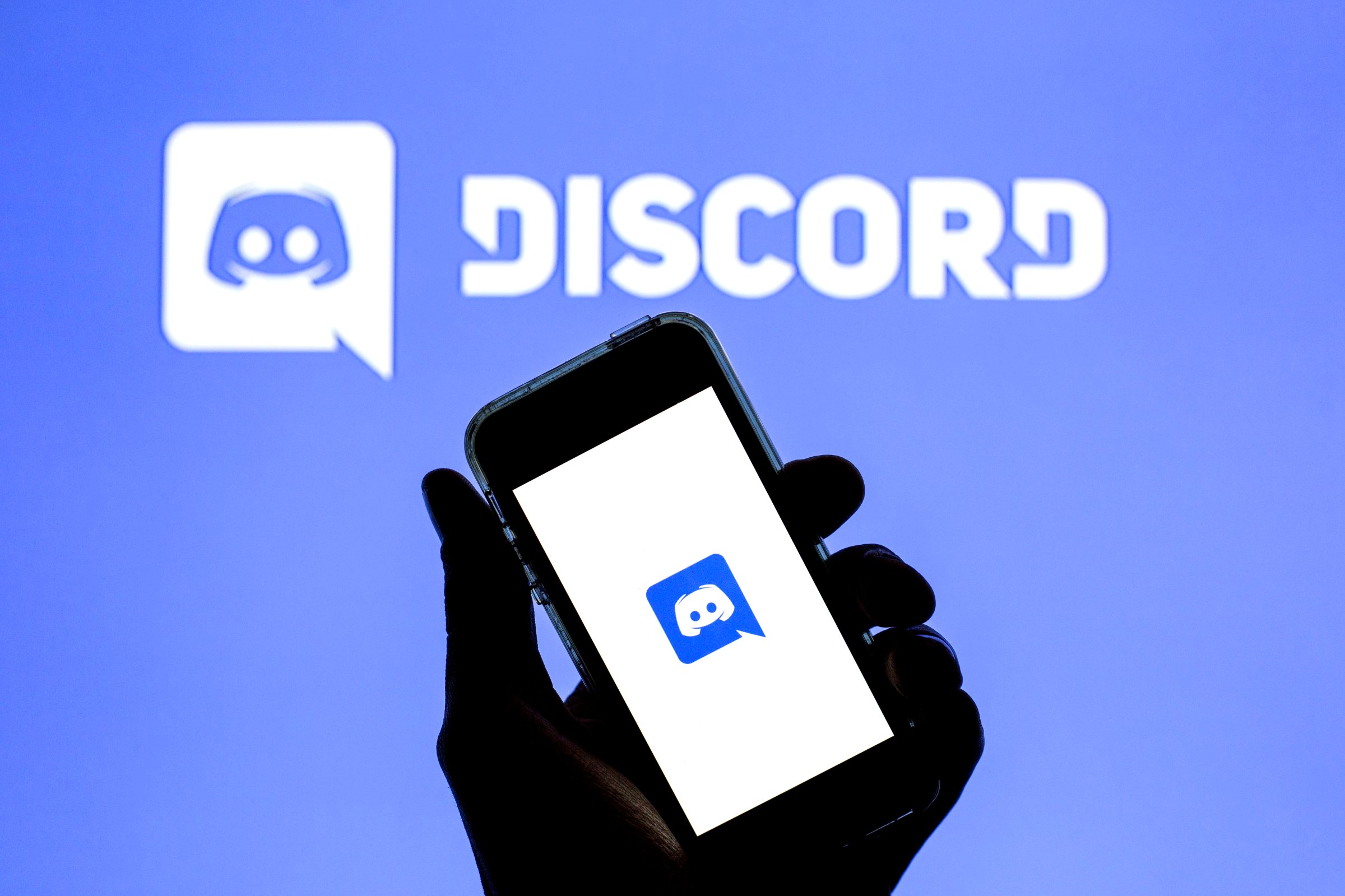 In this photo illustration a Discord logo in seen displayed