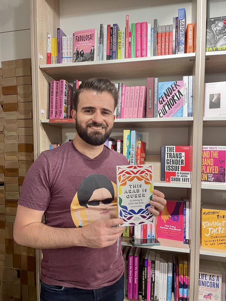 Elias Jahshan, the Editor of 'This Arab is Queer With A Copy of The Anthology.